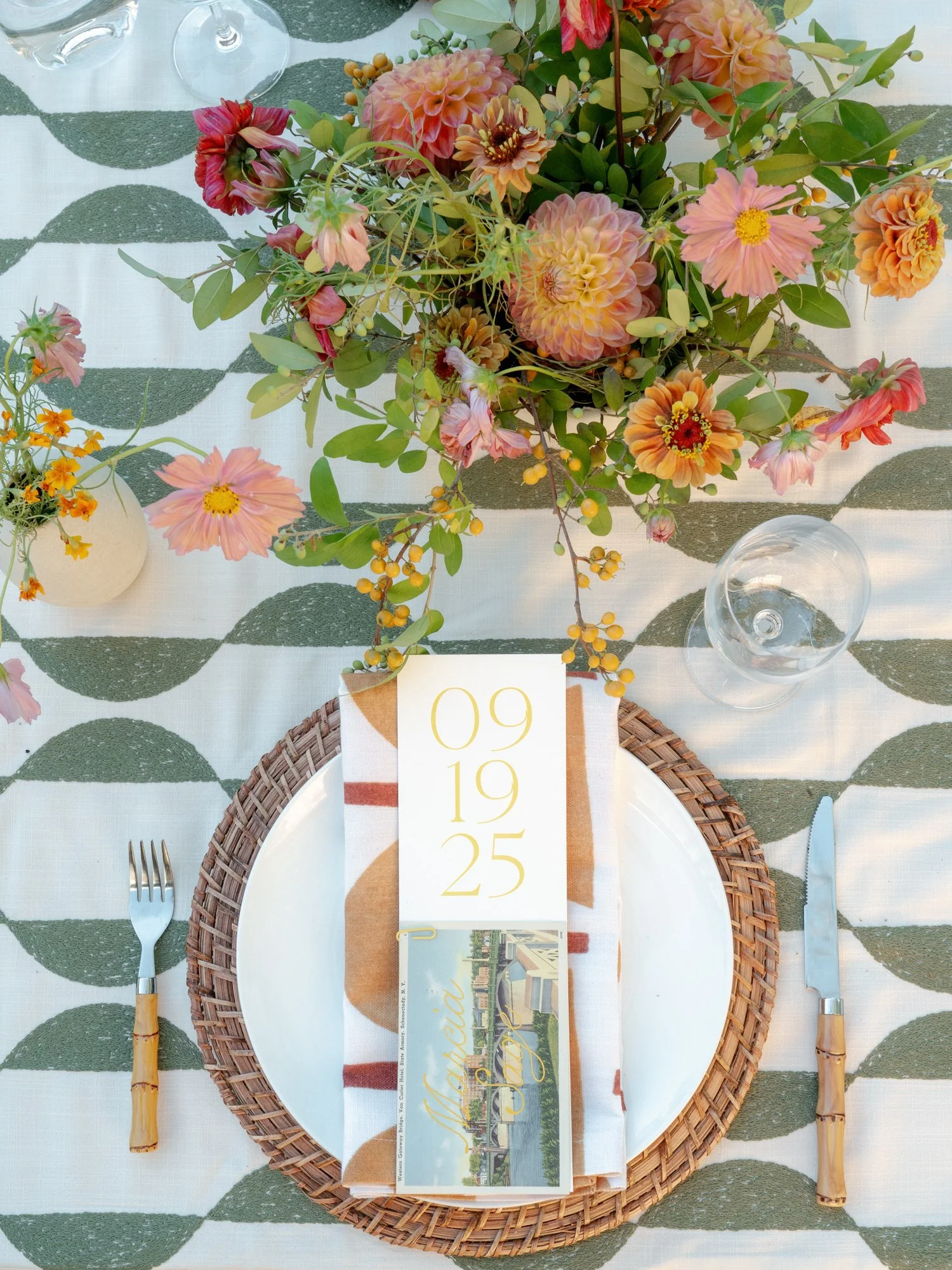 Editorial flatlay of the dinner menu with seasonal florals and patterned linens at Troutbeck in Amenia, photographed by Jenny Fu.