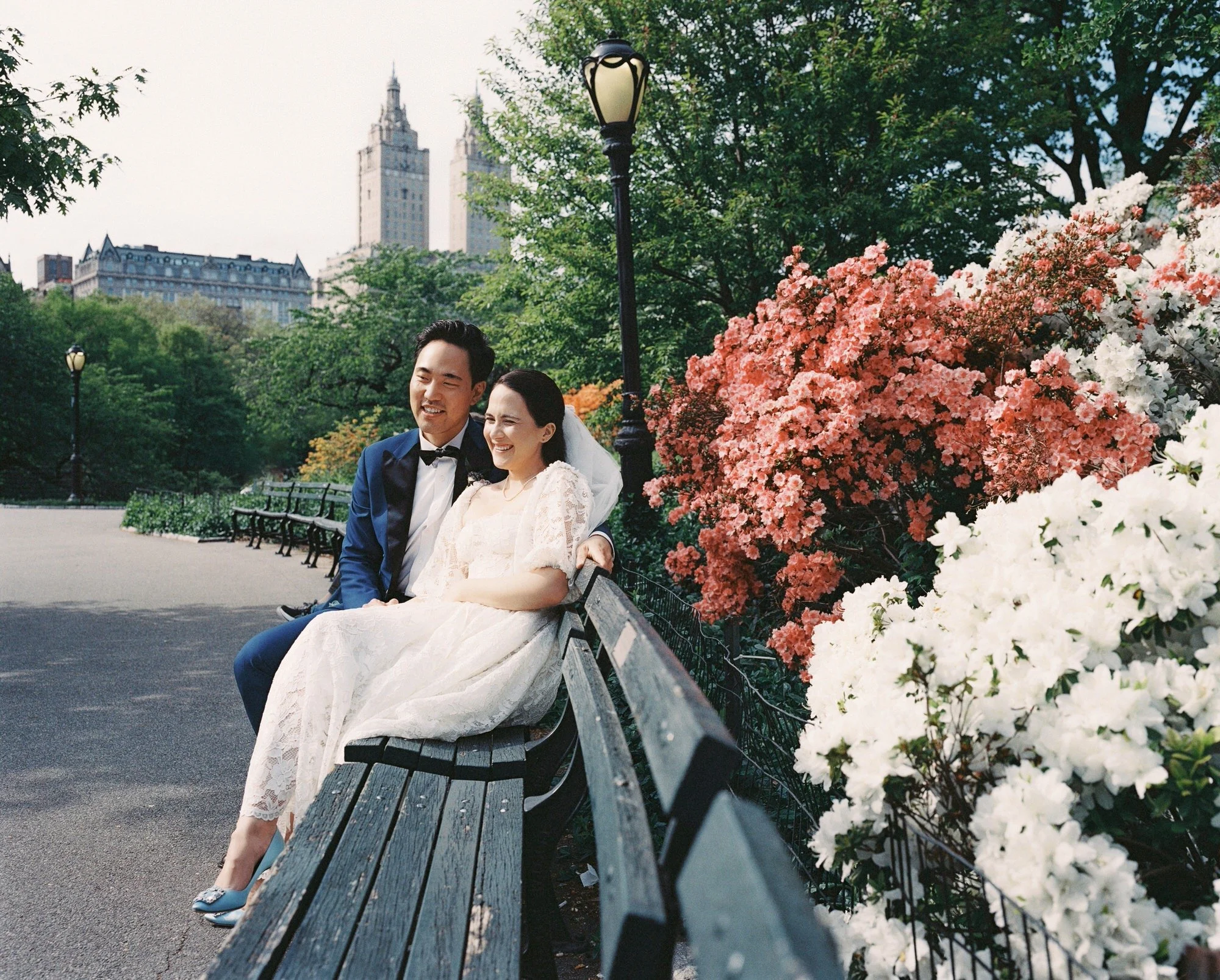 SE-film-16-couple-sitting-on-bench-among-blooming-flowers-spring-central-park-jenny-fu.jpg