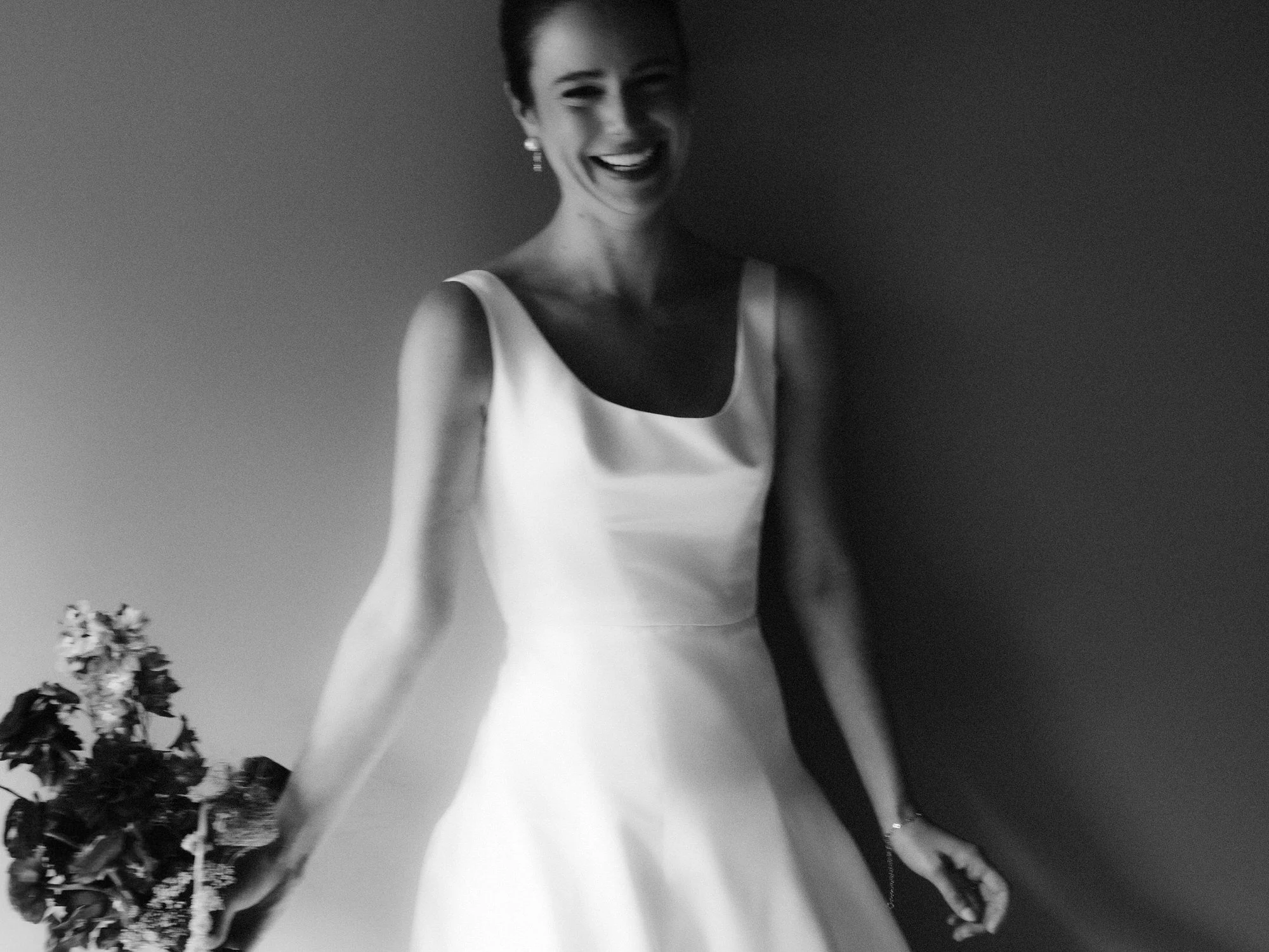 aa-0357-bride-smiling-holding-bouquet-troutbeck-amenia-ny-planned-by-ashley-douglass-jenny-fu.jpg