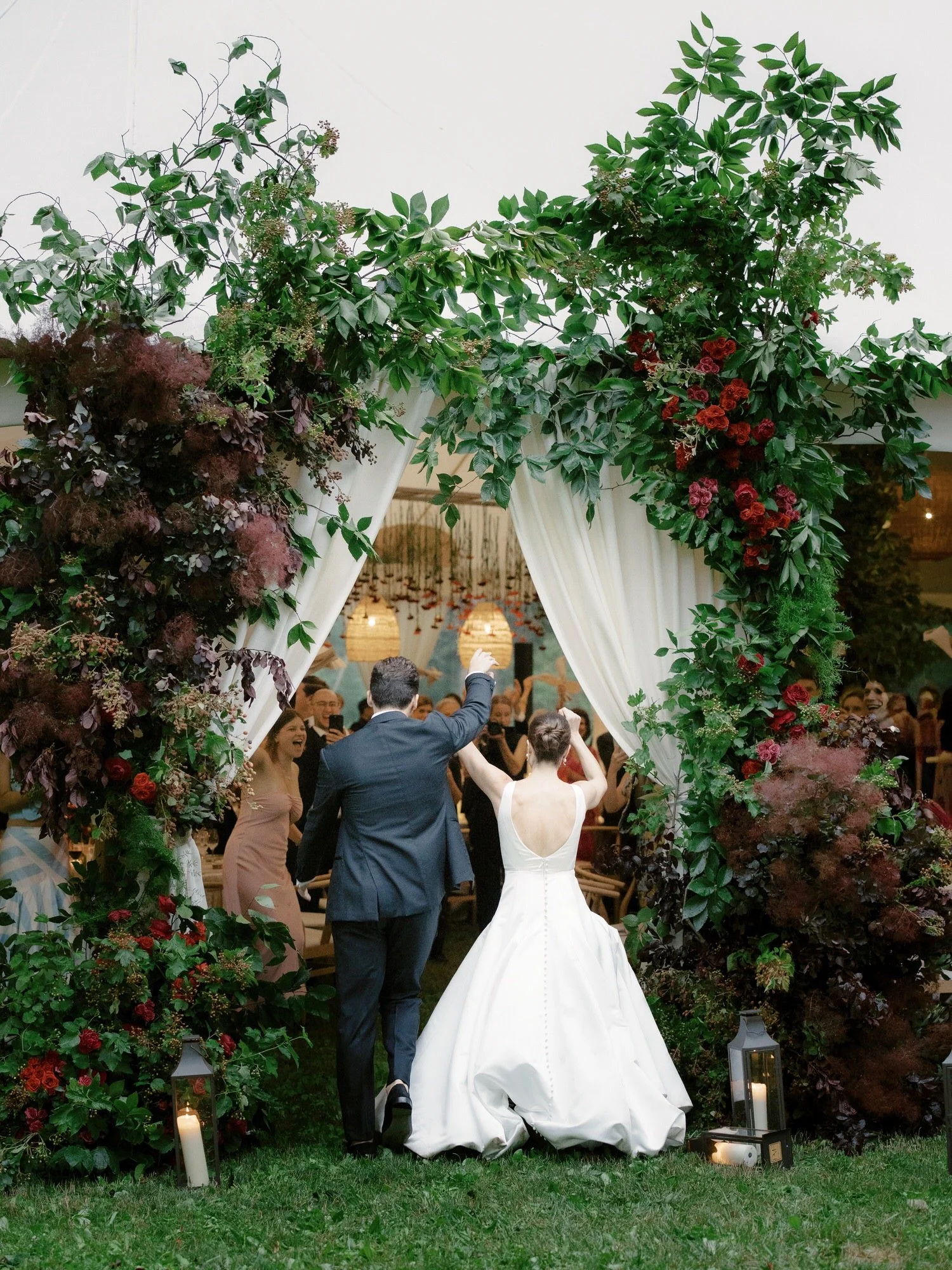 aa-0895-bride-and-groom-grand-entrance-under-floral-arch-troutbeck-amenia-ny-planned-by-ashley-douglass-jenny-fu.jpg