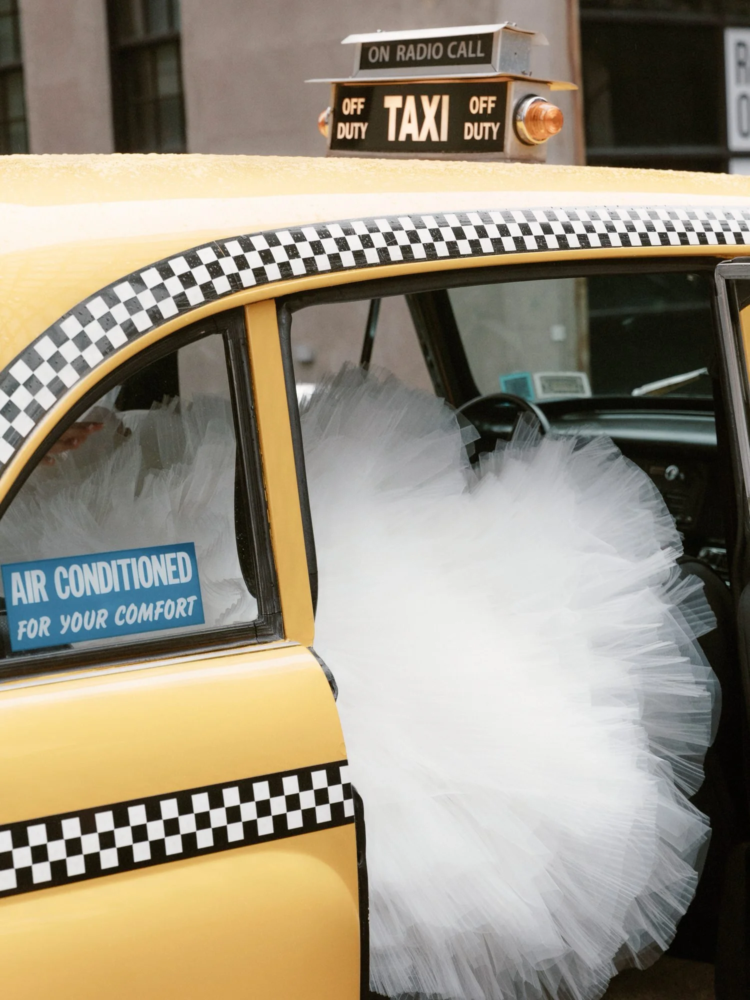 mp42-brides-tulle-gown-billowing-out-of-vintage-taxi-brooklyn-jenny-fu.jpg