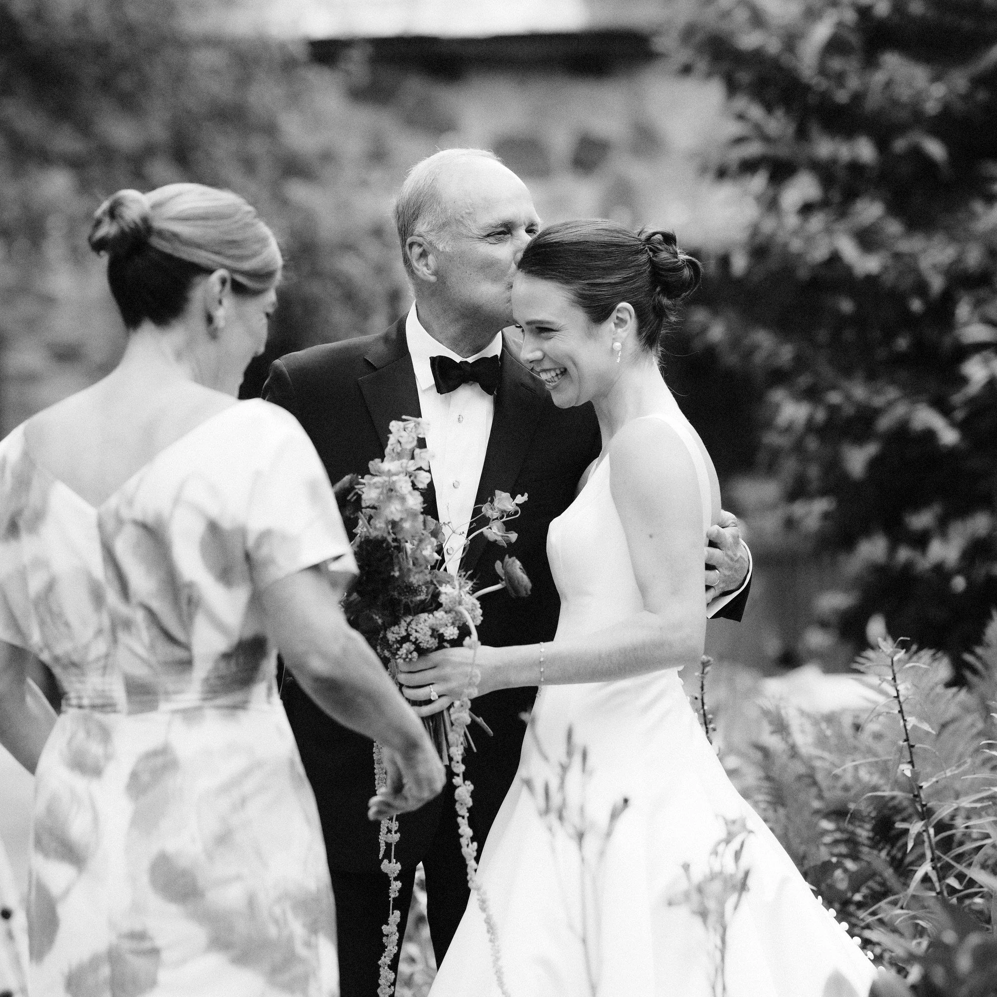 aa-0370-father-of-bride-kissing-daughter-before-ceremony-troutbeck-amenia-ny-planned-by-ashley-douglass-jenny-fu.jpg