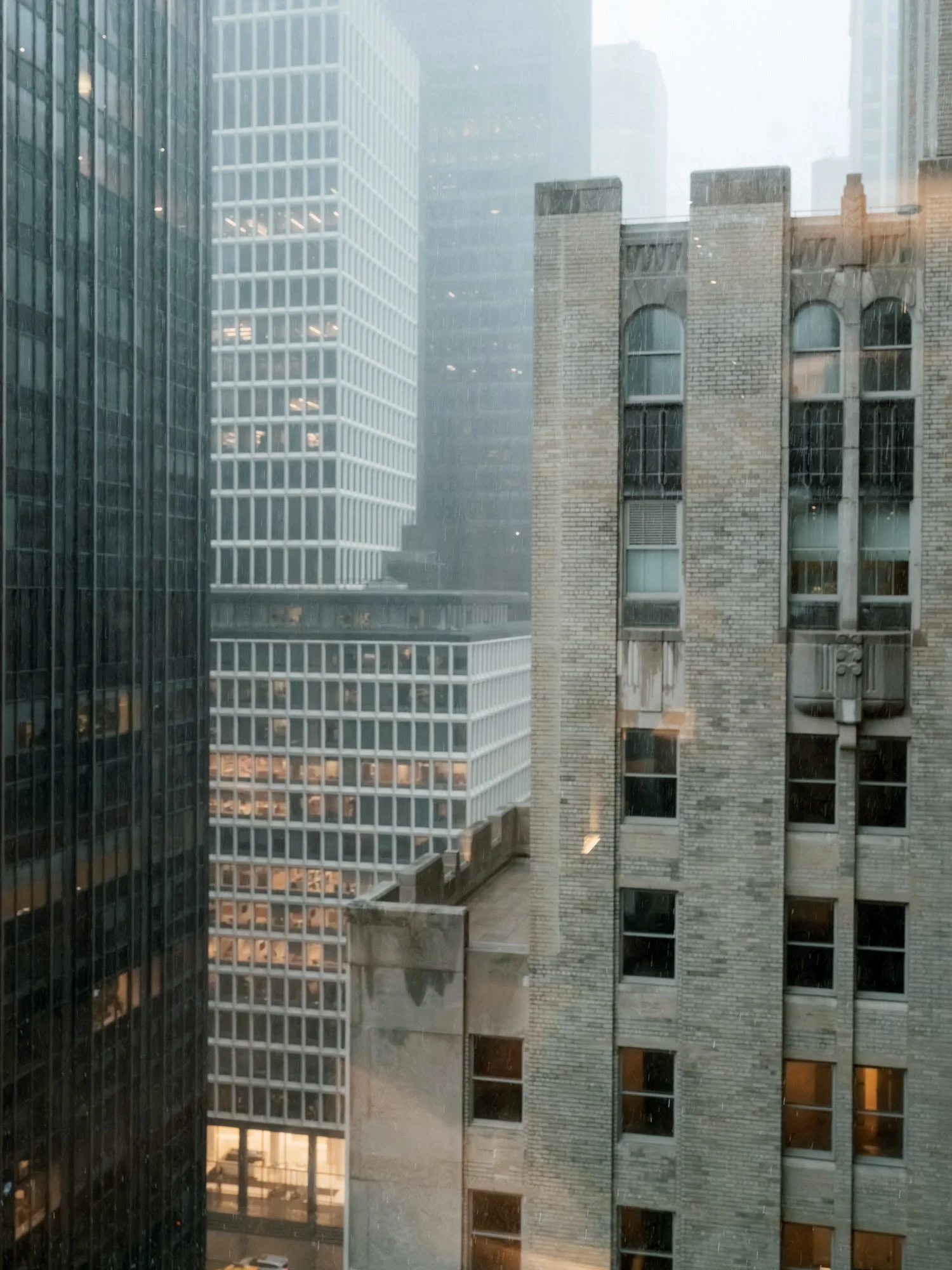Misty Midtown Manhattan skyscrapers seen from the Waldorf Astoria New York on a wedding day, photographed by Jenny Fu.