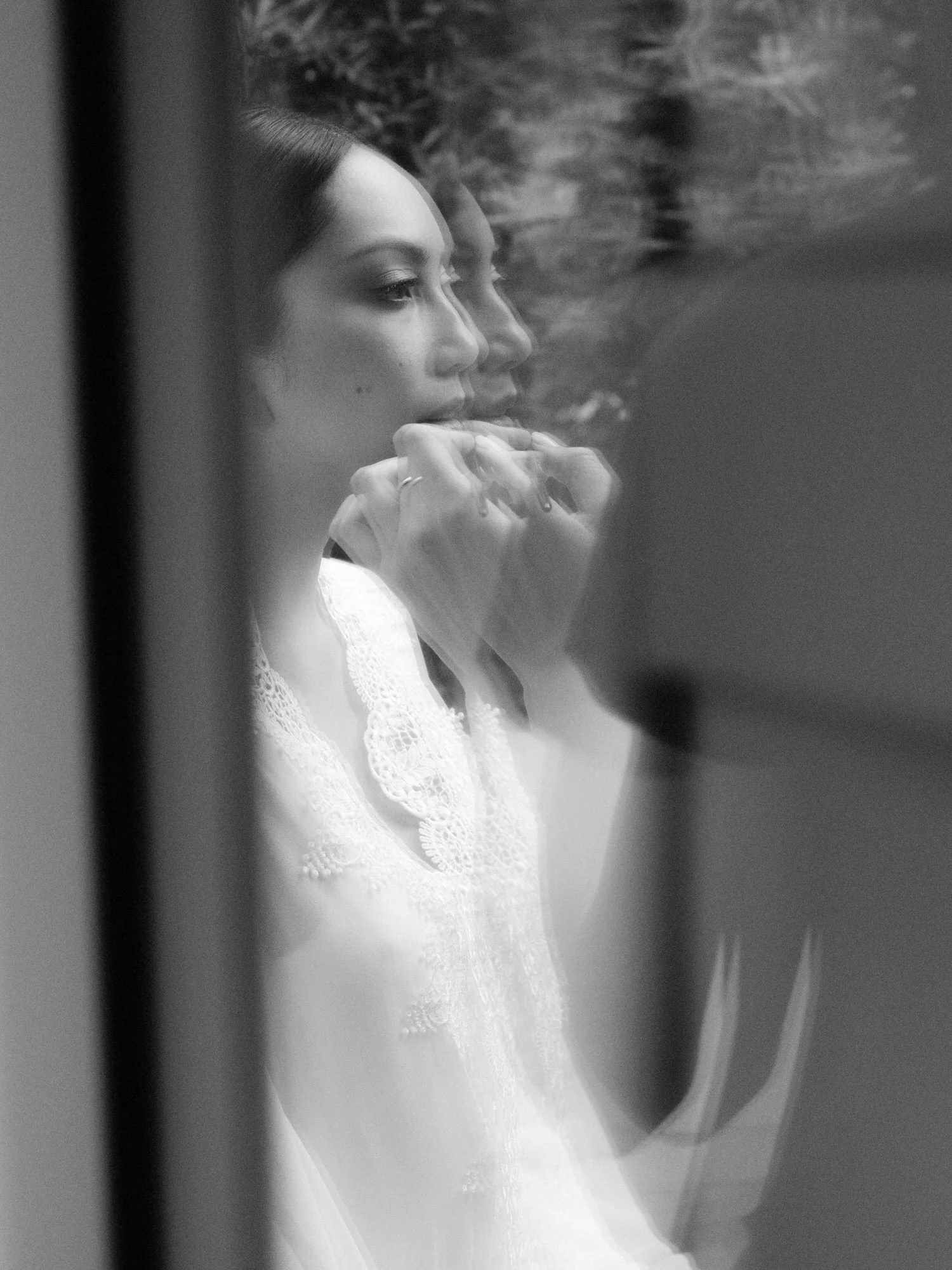 Artful black-and-white reflection portrait of the bride during her getting ready moments at Caruso, A Belmond Hotel in Ravello, Italy, photographed by Jenny Fu.