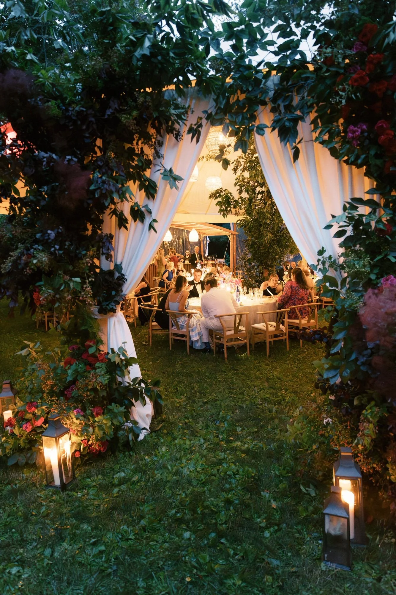 aa-0967-view-of-reception-tent-through-floral-arch-troutbeck-amenia-ny-planned-by-ashley-douglass-jenny-fu.jpg