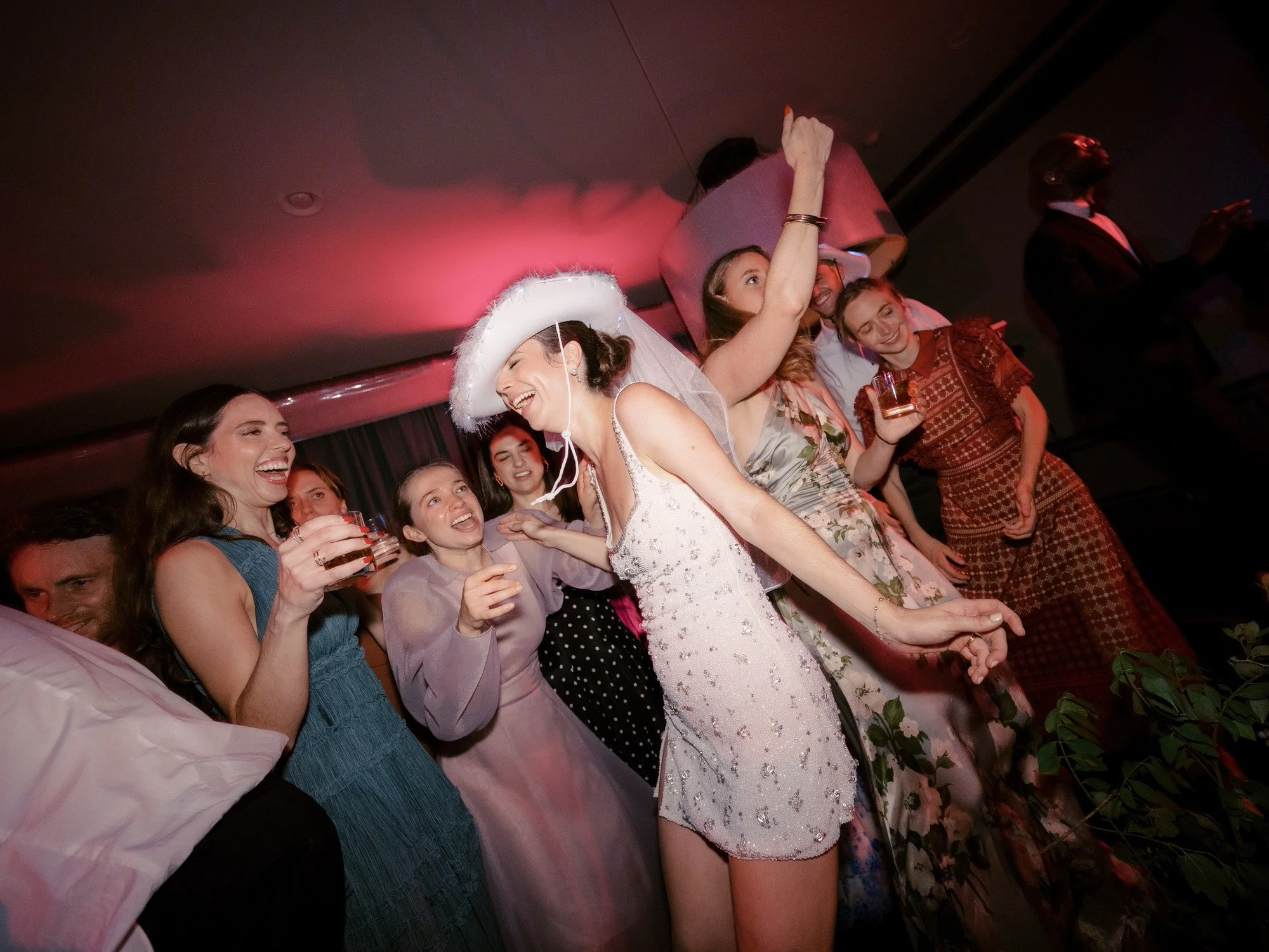 aa-1221-bride-dancing-in-feather-cowboy-hat-troutbeck-amenia-ny-planned-by-ashley-douglass-jenny-fu.jpg