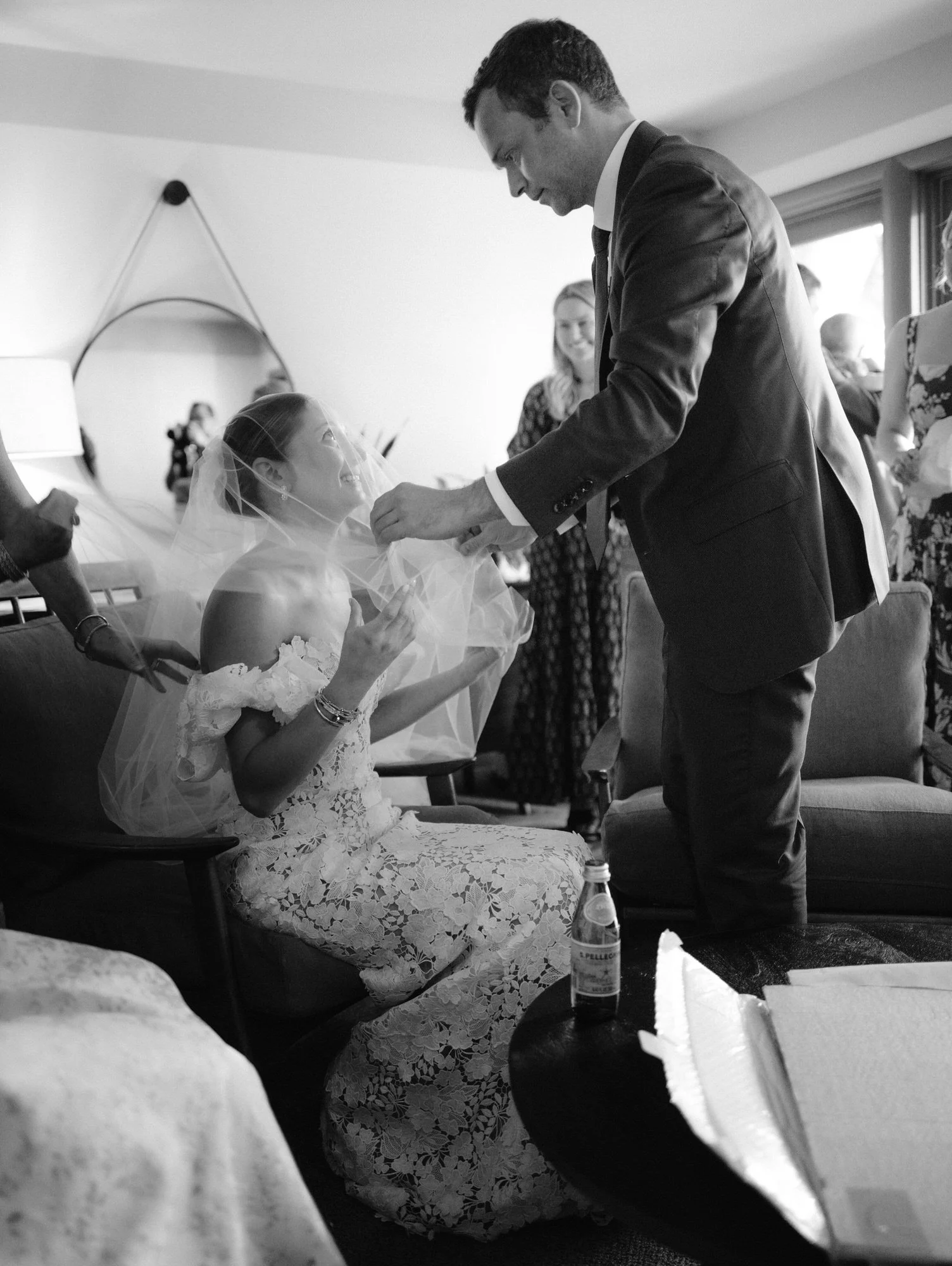 Groom lifting the bride’s veil in an emotional moment inside the suite before the ceremony at Troutbeck in Amenia, photographed by Jenny Fu.