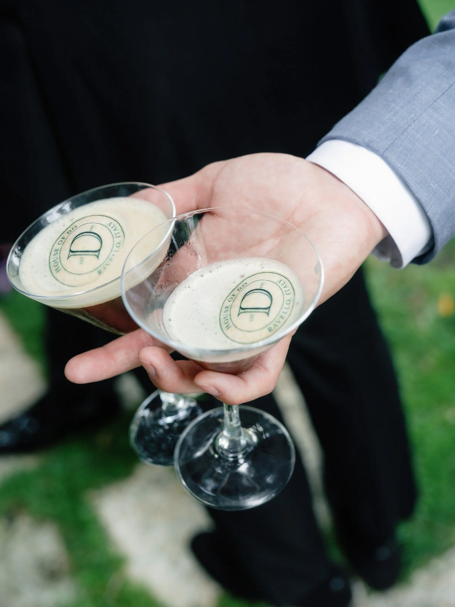 Close-up of two espresso martinis with custom monogrammed foam served during cocktail hour at Caruso, A Belmond Hotel in Ravello, Italy, photographed by Jenny Fu.