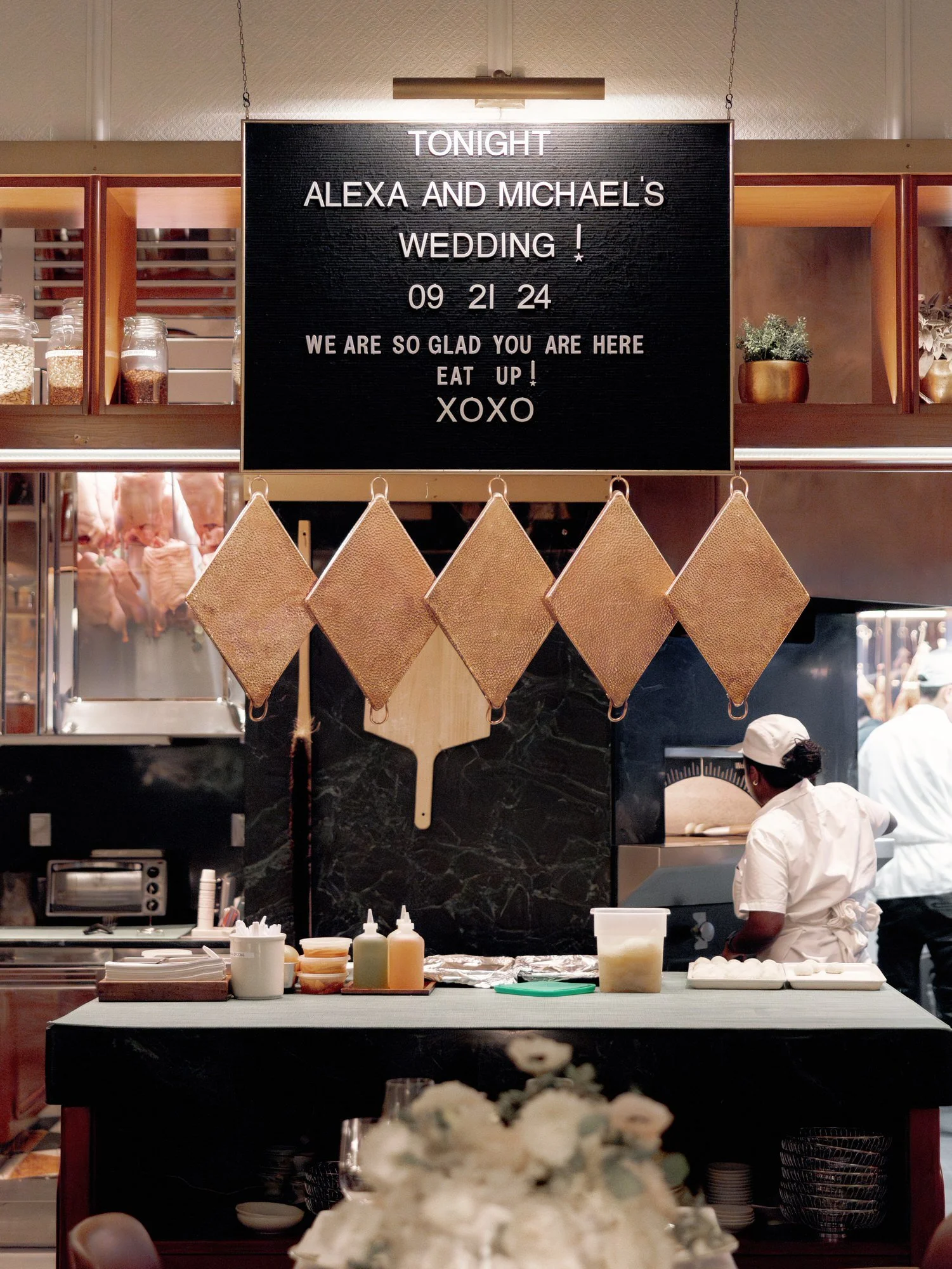 Elegant restaurant kitchen sign announcing Alexa and Michael’s wedding at Torrisi in Manhattan, photographed by Jenny Fu.