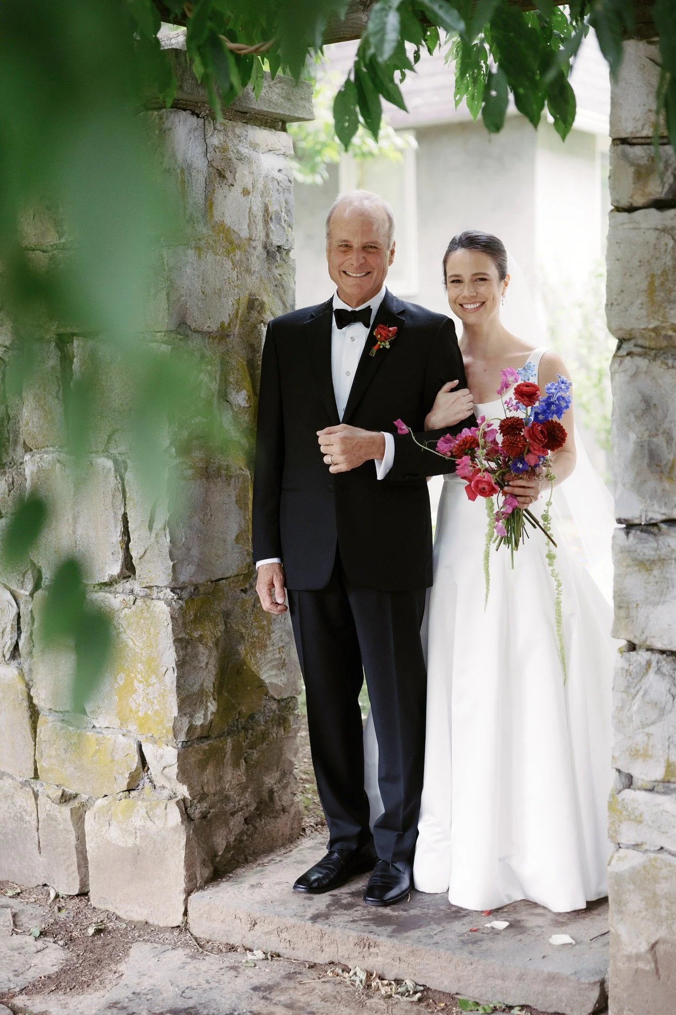 aa-0622-bride-and-father-standing-under-stone-arch-troutbeck-amenia-ny-planned-by-ashley-douglass-jenny-fu.jpg