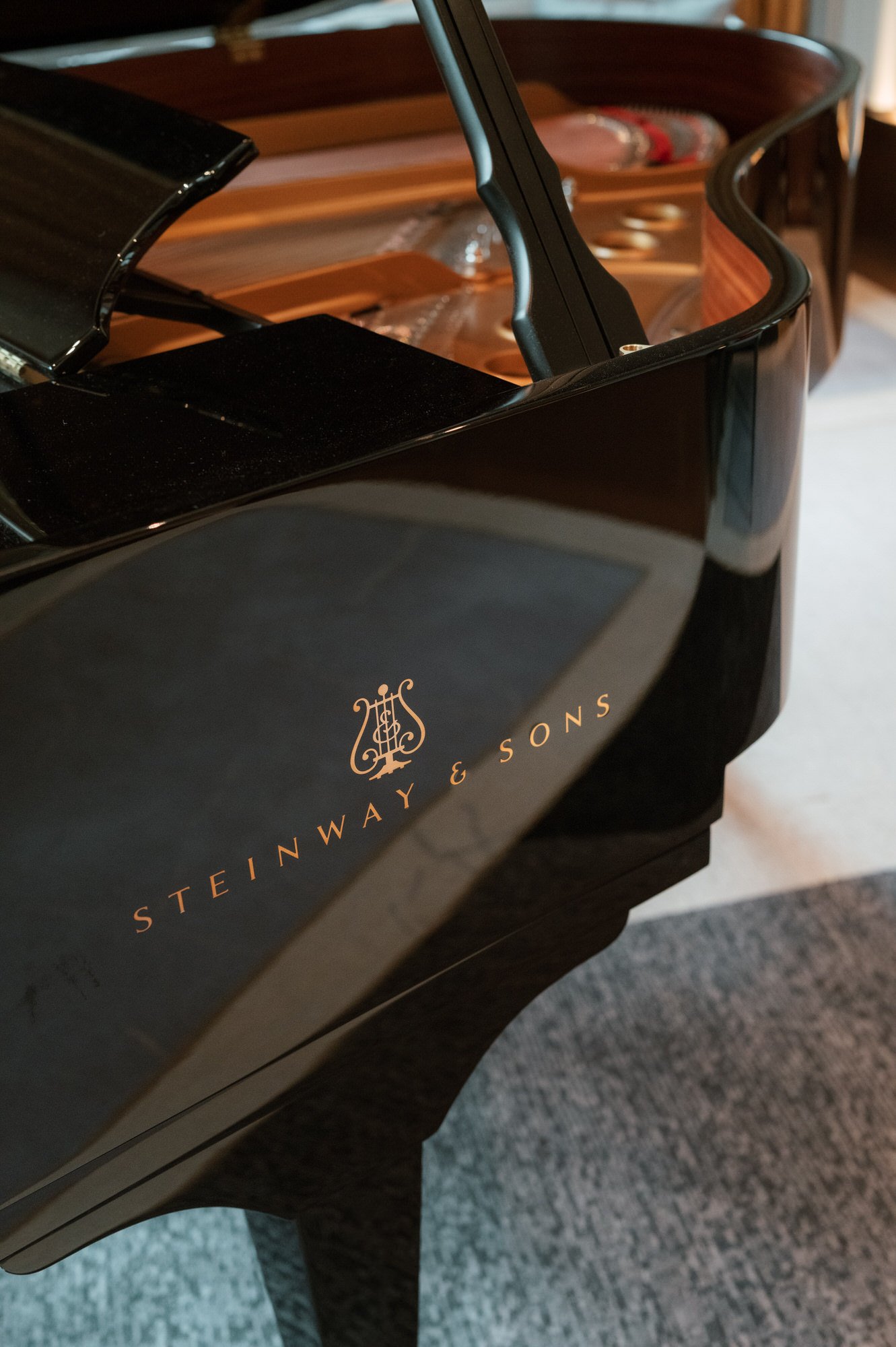 Close-up of a black Steinway and Sons grand piano at the Waldorf Astoria New York, photographed by Jenny Fu.