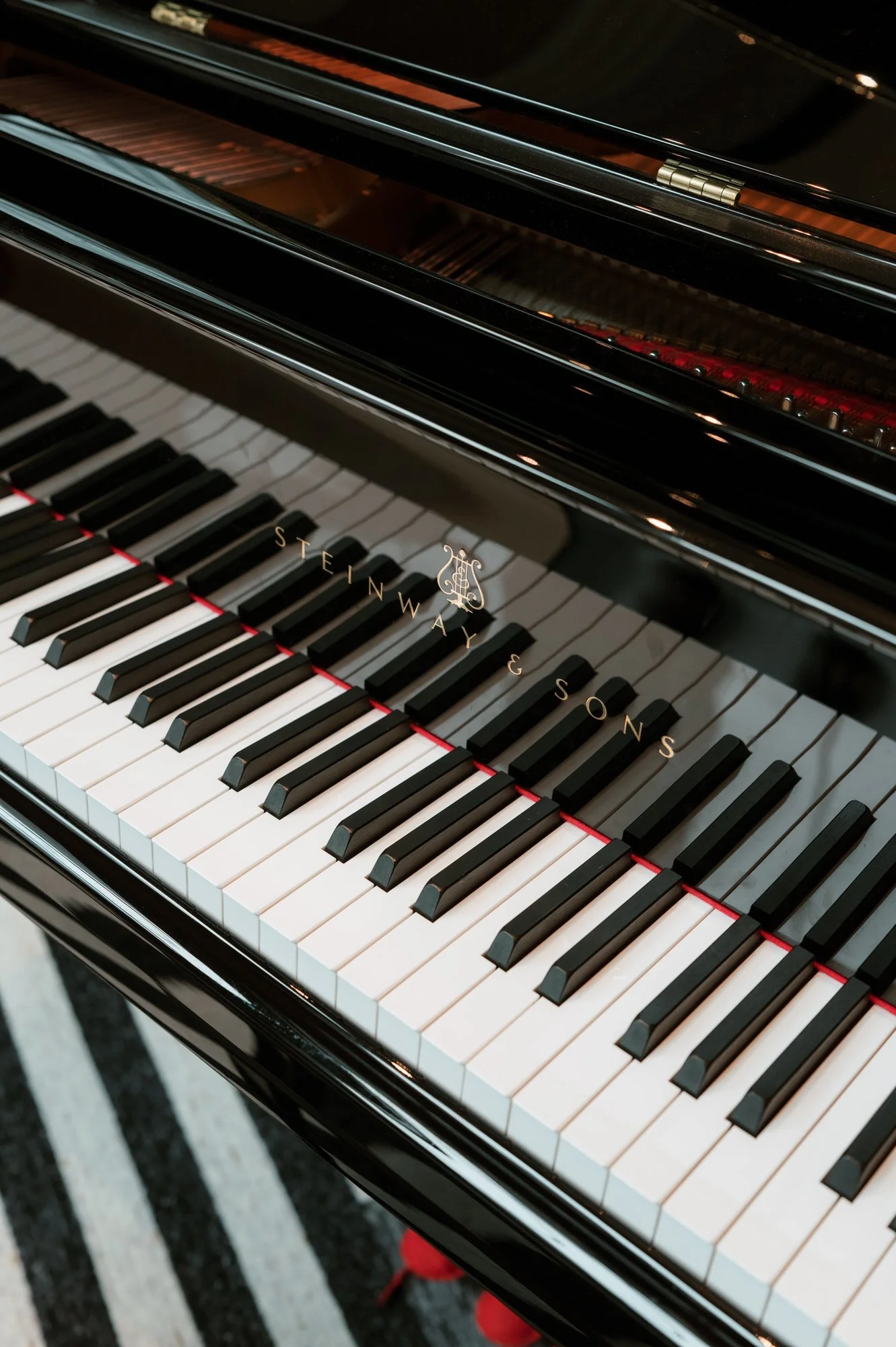 Close-up of the keys of a Steinway grand piano at the Waldorf Astoria New York, photographed by Jenny Fu.