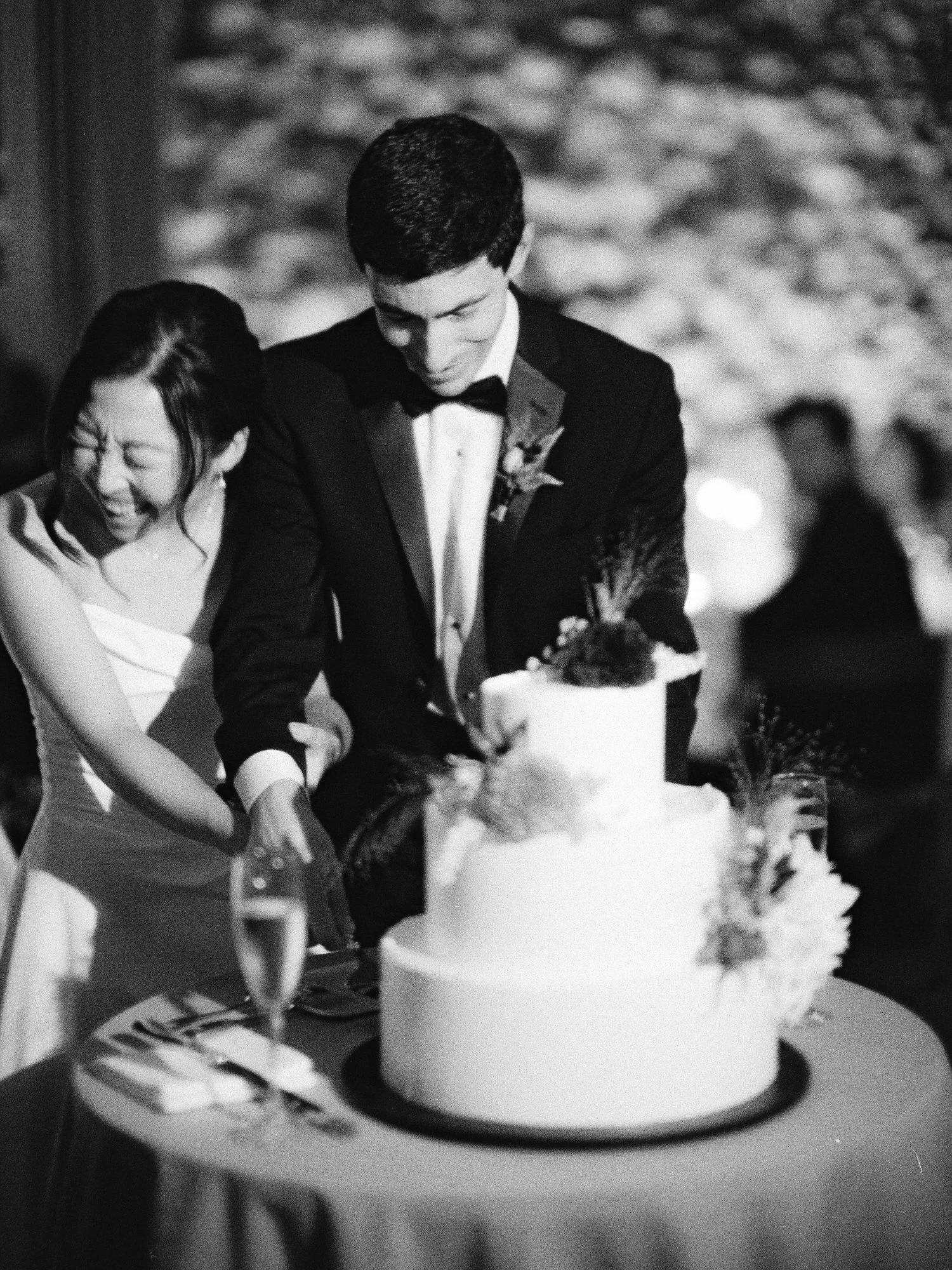 Cake cutting captured on film in black and white at Blue Hill at Stone Barns, photographed by Jenny Fu.
