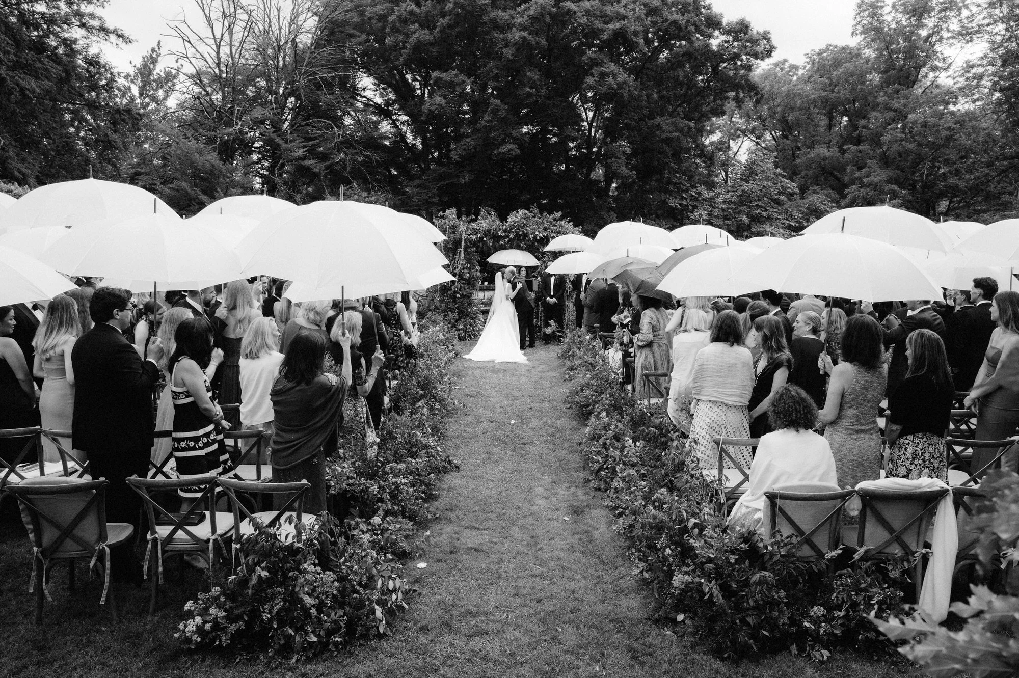 aa-0649-ceremony-with-white-umbrellas-in-garden-troutbeck-amenia-ny-planned-by-ashley-douglass-jenny-fu.jpg