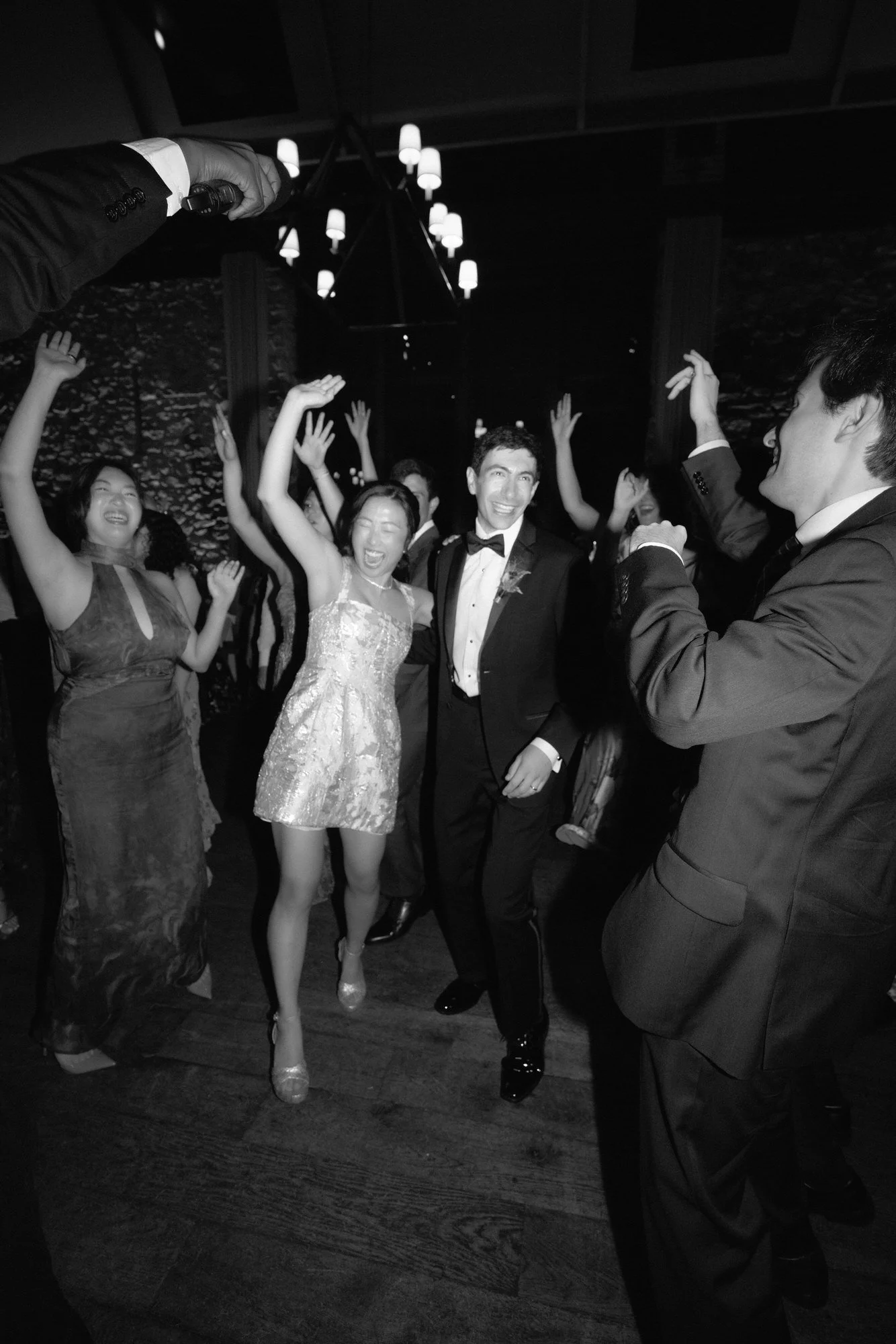 Late-night dance floor energy in black and white with the couple and friends at Blue Hill at Stone Barns, photographed by Jenny Fu.