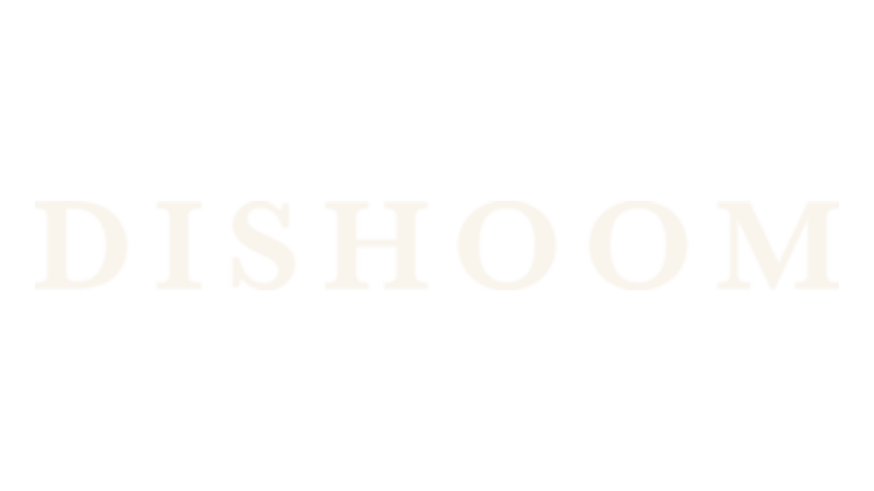 The image displays the word "DISHOOM" in bold, white capital letters on a black background.