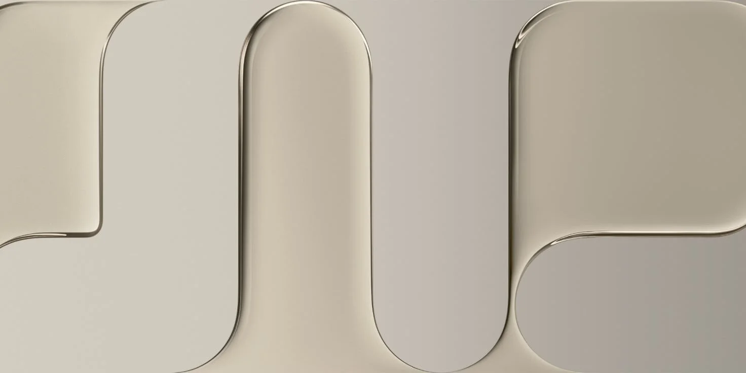 Close-up of a beige keyboard with rounded keys.