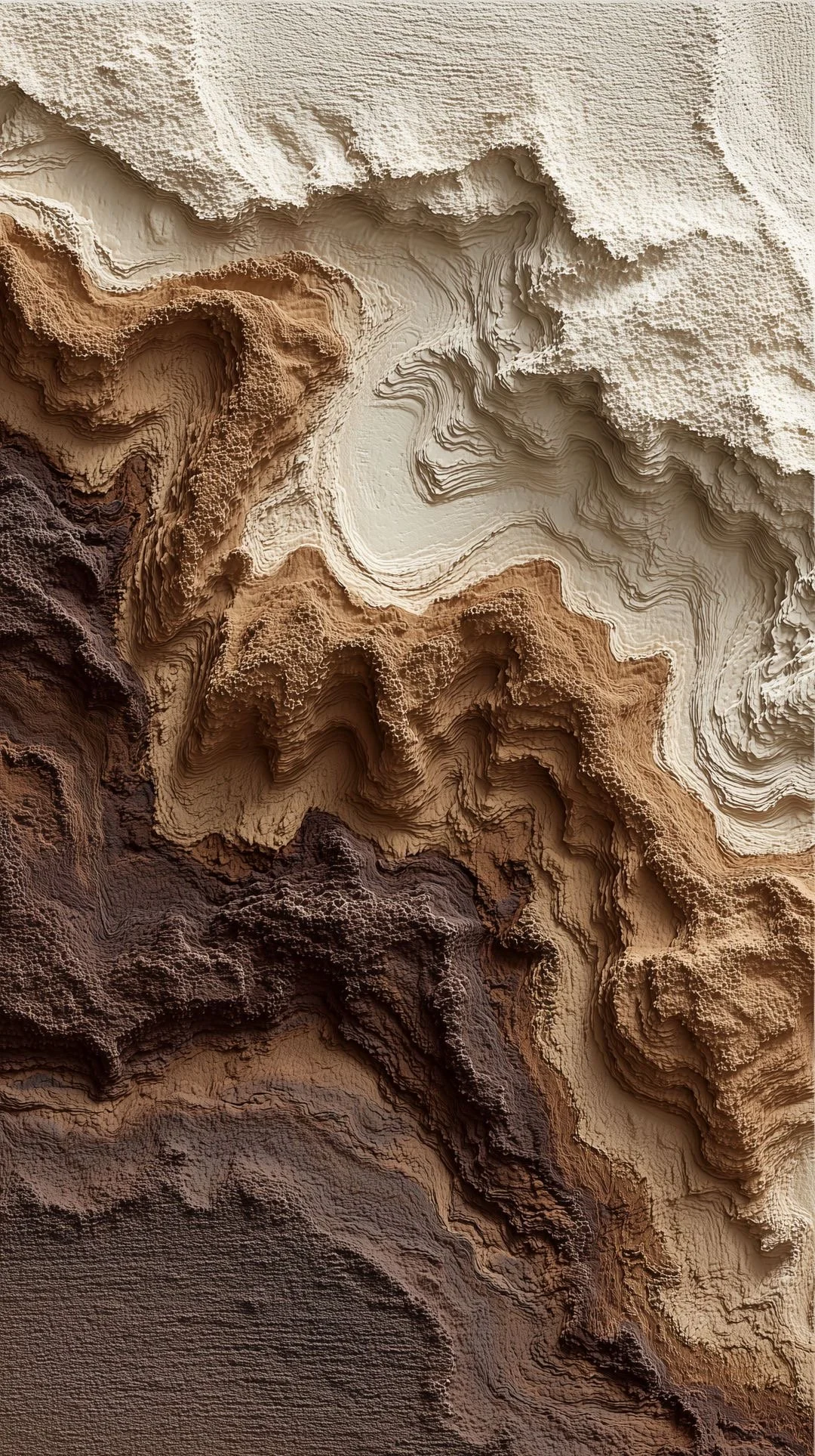 A textured abstract art piece with layered, paper-like formations in shades of beige, cream, brown, and dark brown, resembling geological formations or topographical map.