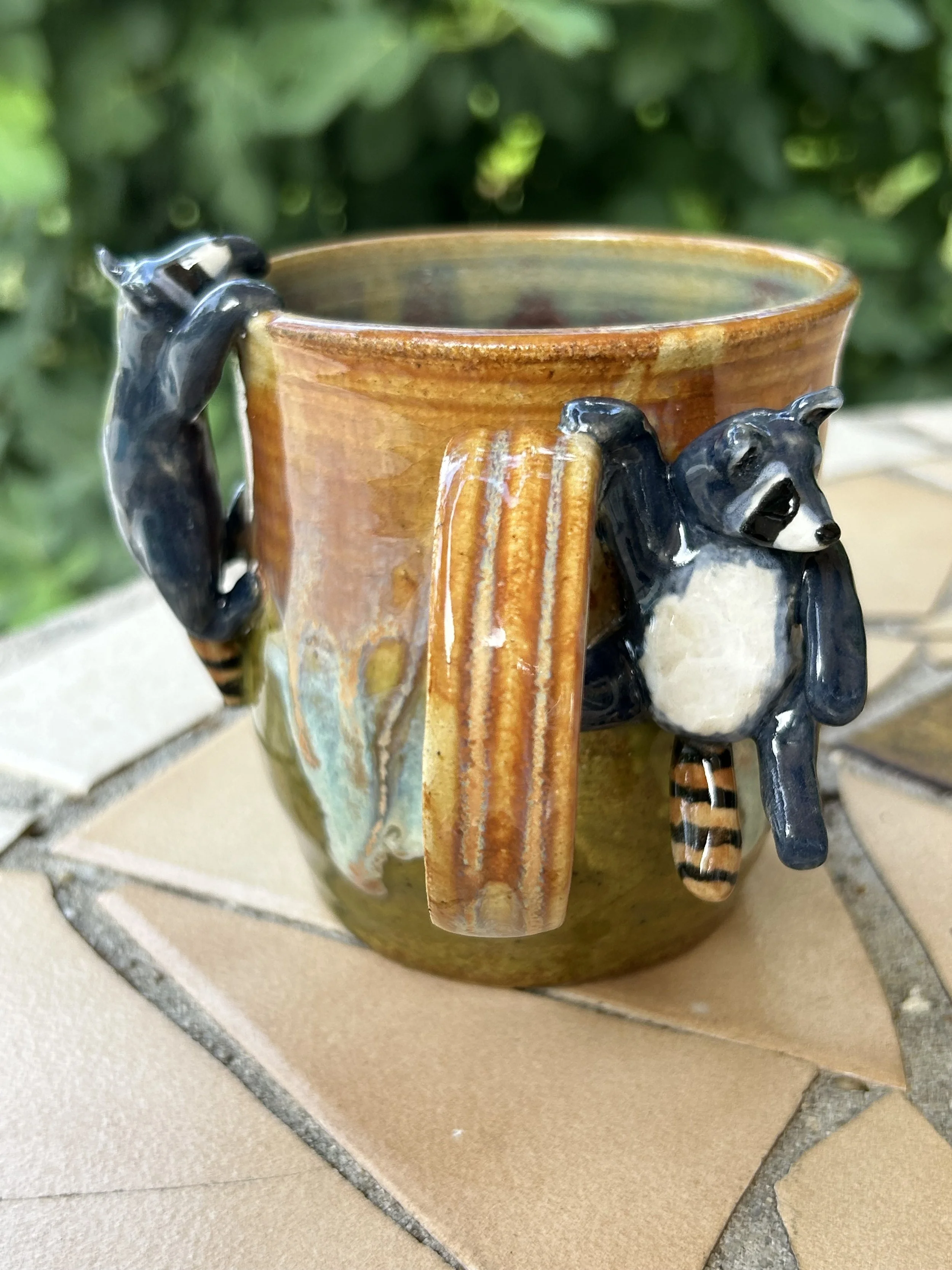 Hanging Mischievous Raccoons Ceramic Mug