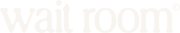 A blurred white background with faint text that appears to say 'wait' or 'wait room'.