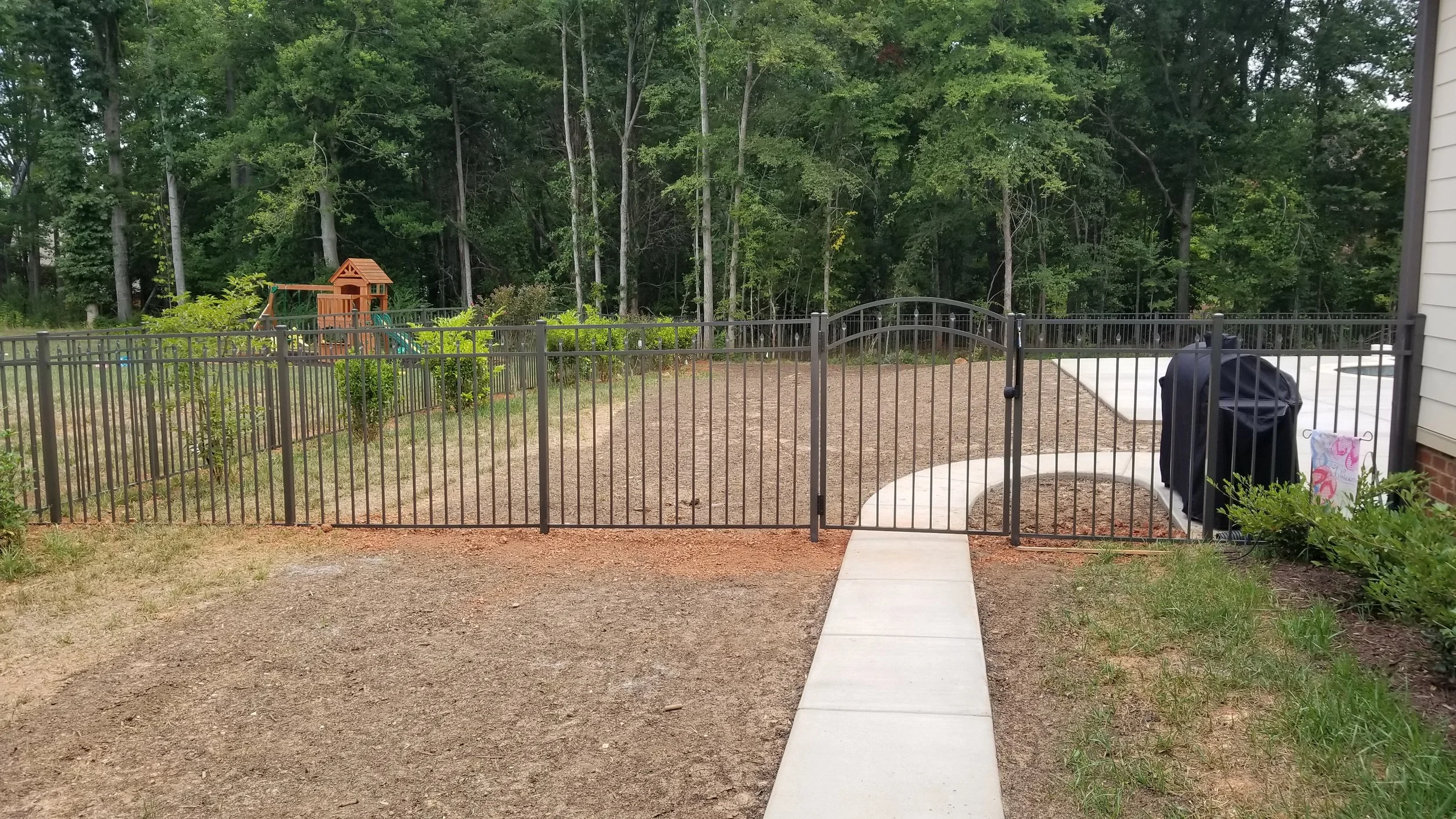 Bronze Fence in Woods.jpg