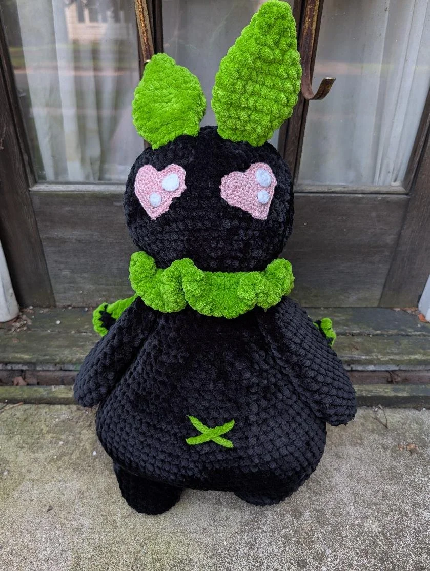 XXL Mothman. Made with our own pattern in a custom green-and-pink color scheme.
He is approximately 2 feet tall and weighs three pounds!