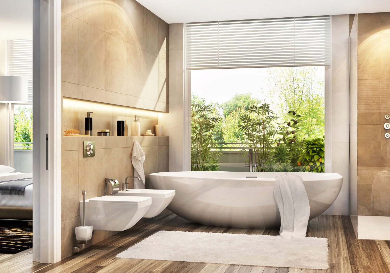 Modern bathroom with a large bathtub, bidet, and toilet near a large window with a view of greenery. Light wood flooring and beige tiled walls, with decorative vases on a shelf.