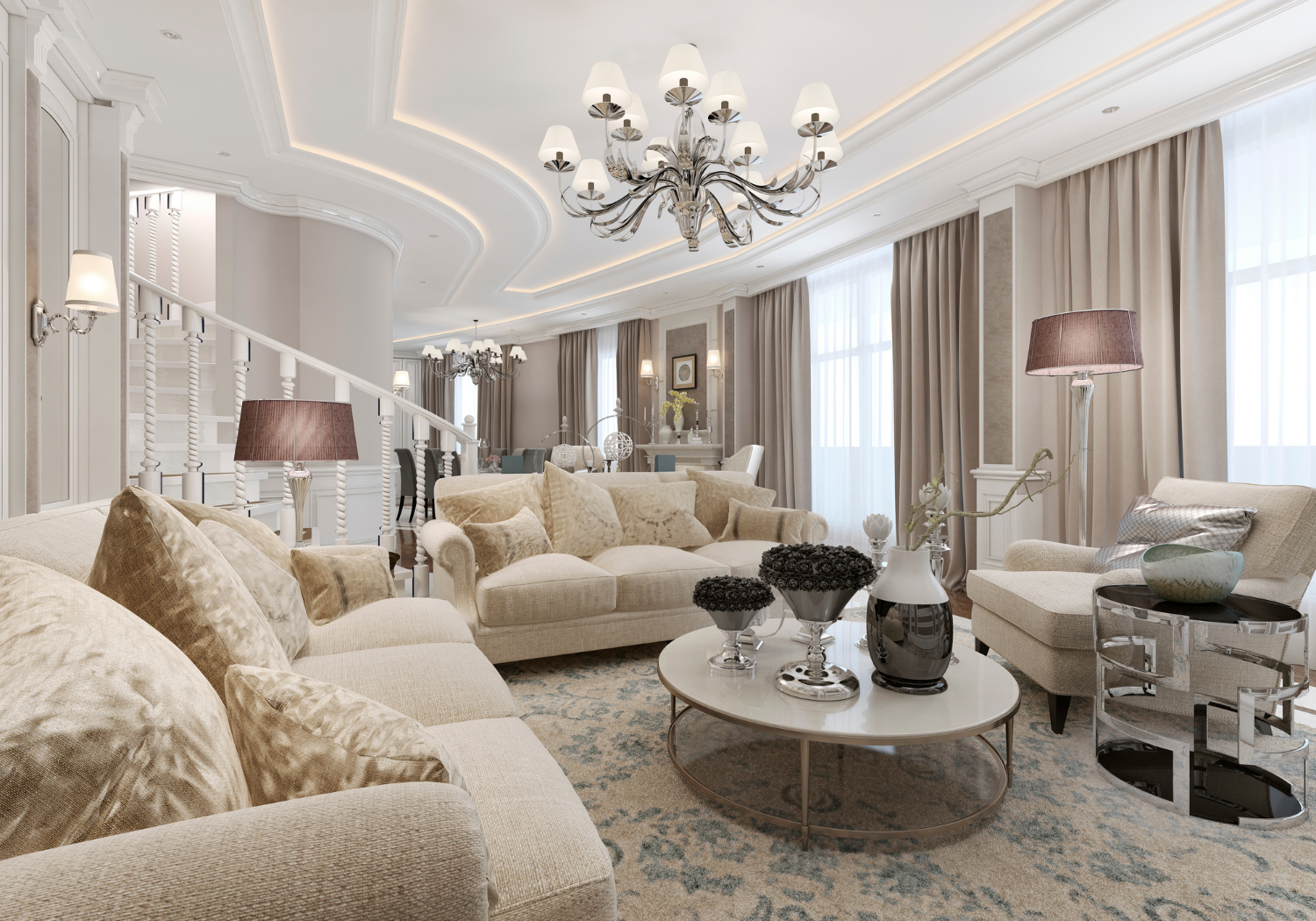 Luxurious living room with beige sofas, a white coffee table with decorative vases, and large windows with beige curtains, featuring elegant chandeliers and soft lighting.