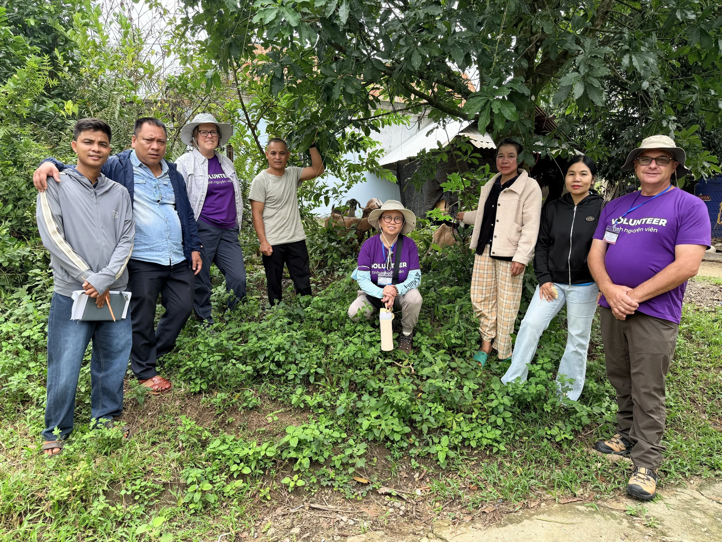 A committee of volunteers and local representatives gathering for the animal husbandry program