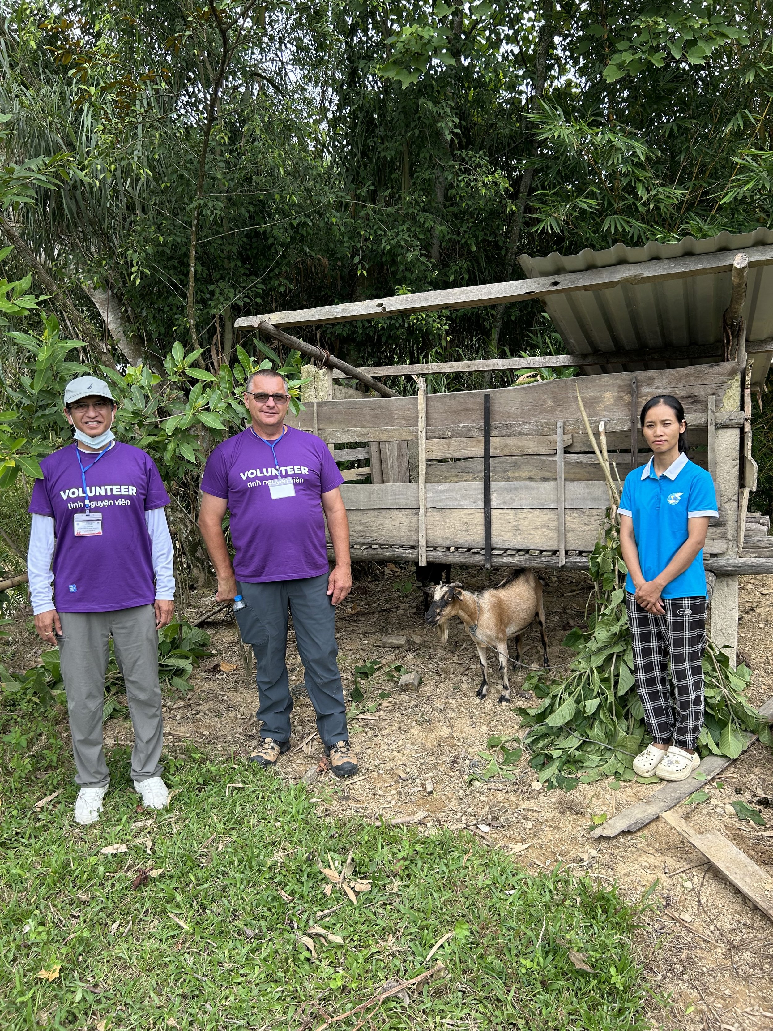 HLF volunteers helping educate farmers about goat raising