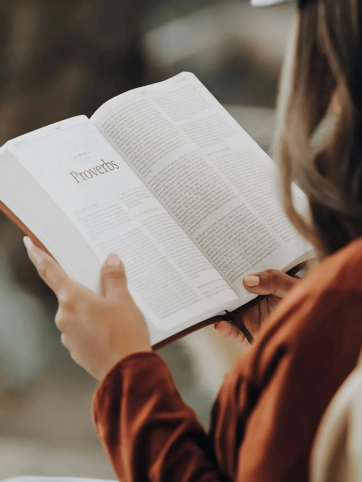A person reading a Bible.
