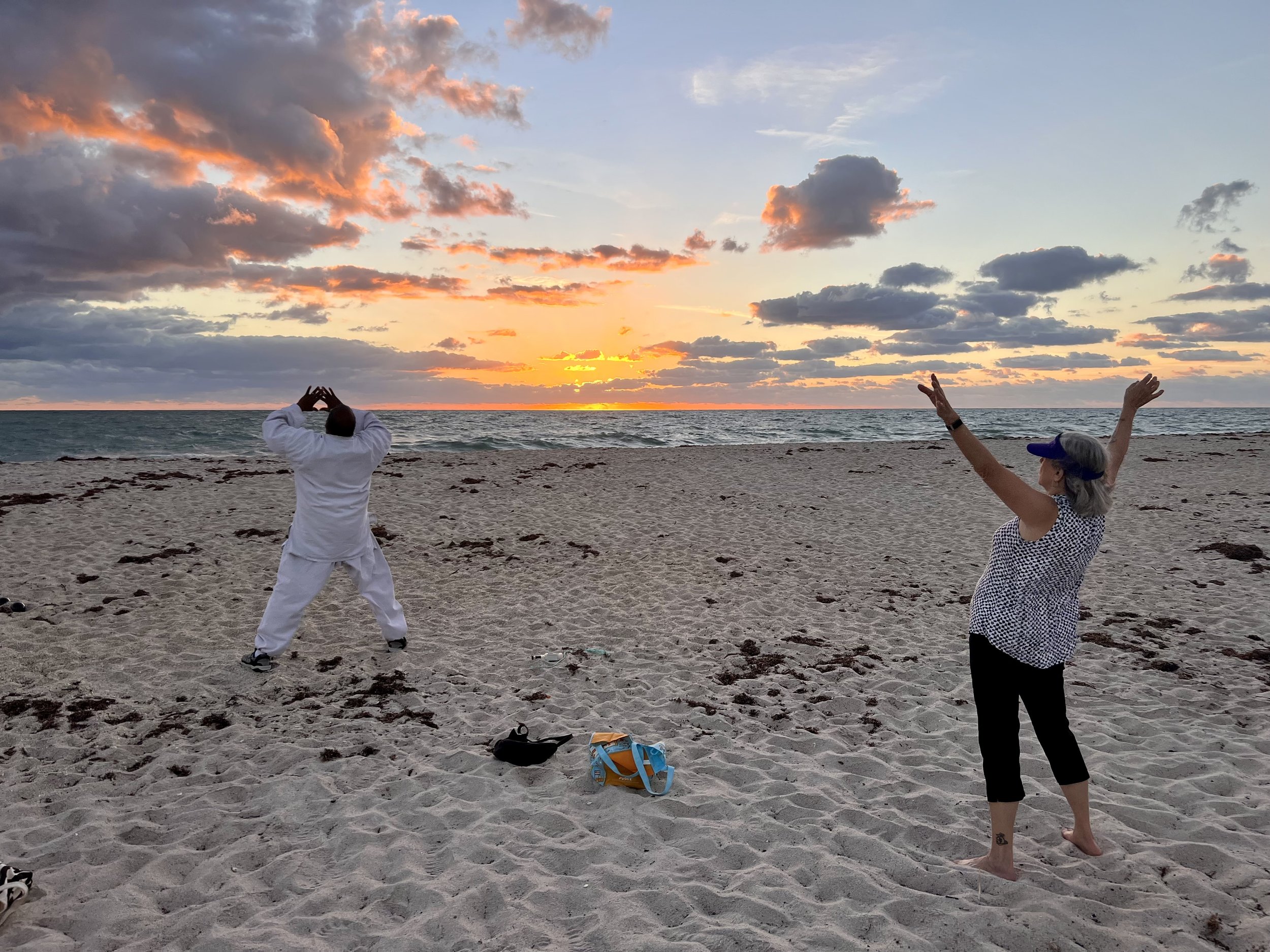 Practicing qigong at sunrise at South Beach in Vero Beach, Florida