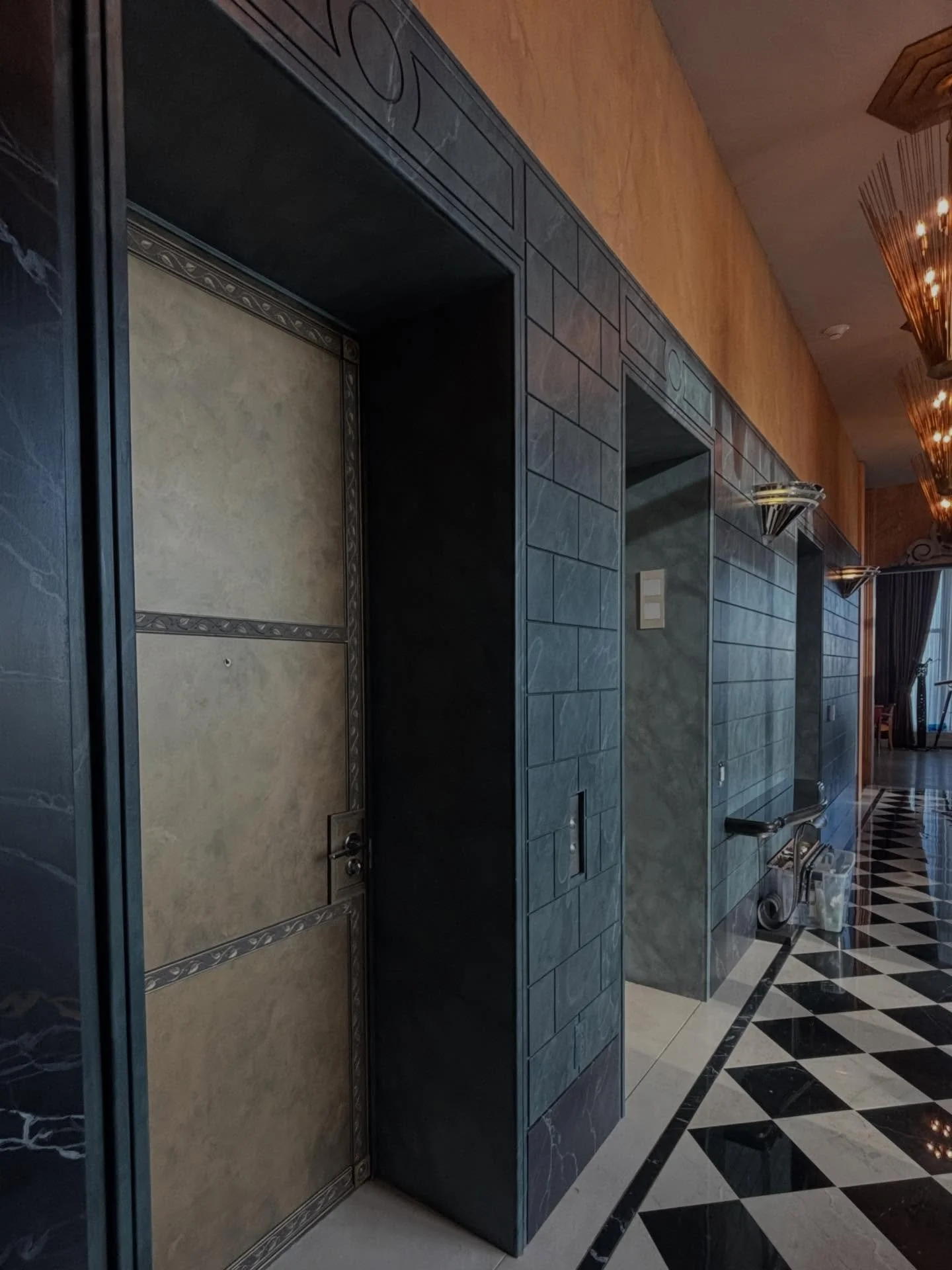The entry hall of our UES project is taking shape, with custom bronze elevator doors bringing depth and patina to the space.

design @coryharrisondesign 
faux paint + paneling @tommyfoxart