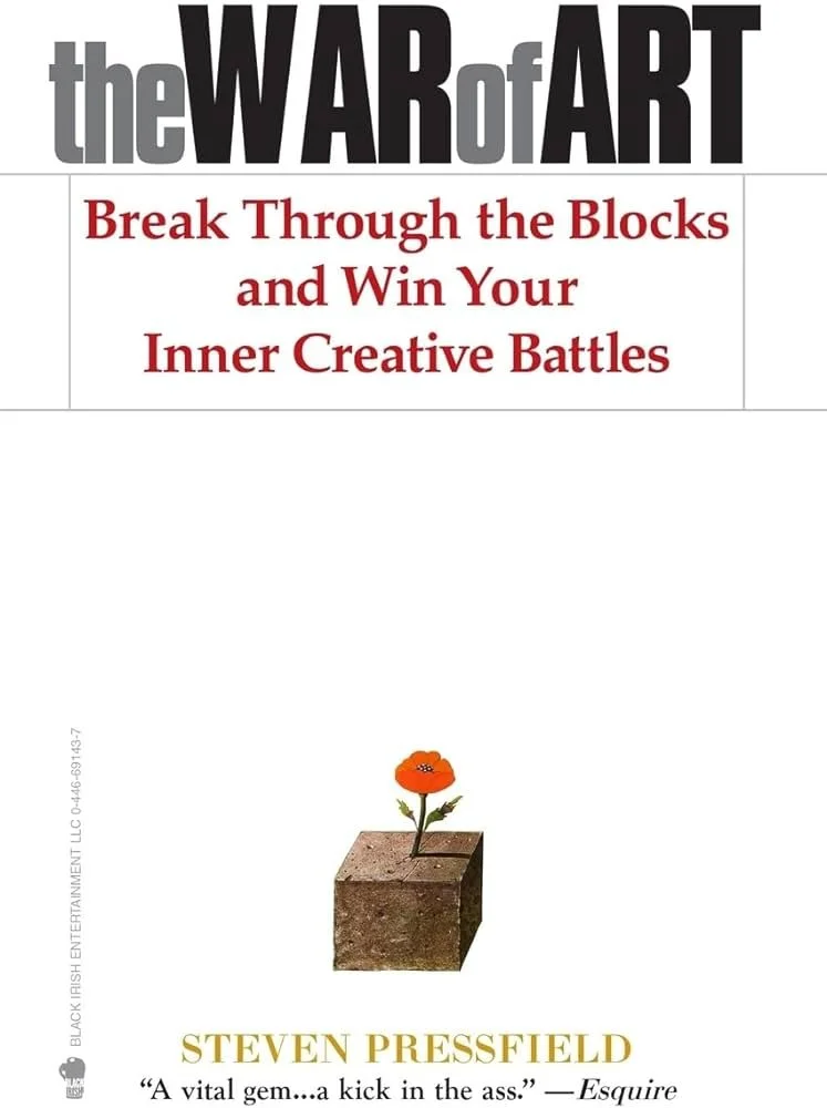 Book cover titled "The WAR of ART" with subtitle "Break Through the Blocks and Win Your Inner Creative Battles," featuring a small flower growing out of a block of dirt, written by Steven Pressfield.