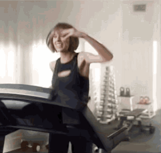 Taylor Swift dancing and running on a tredmill, then falling off