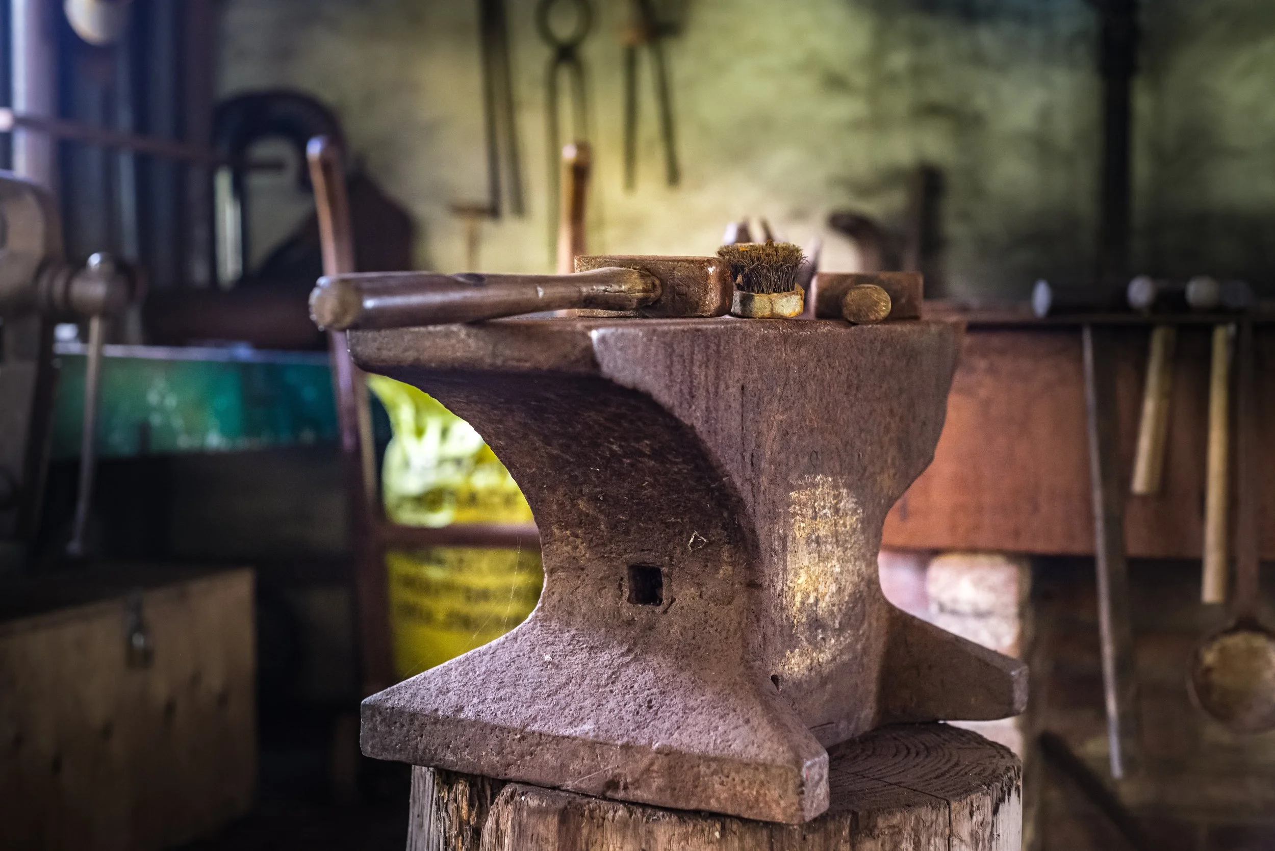 iron anvil and blacksmithing tools in a workshop