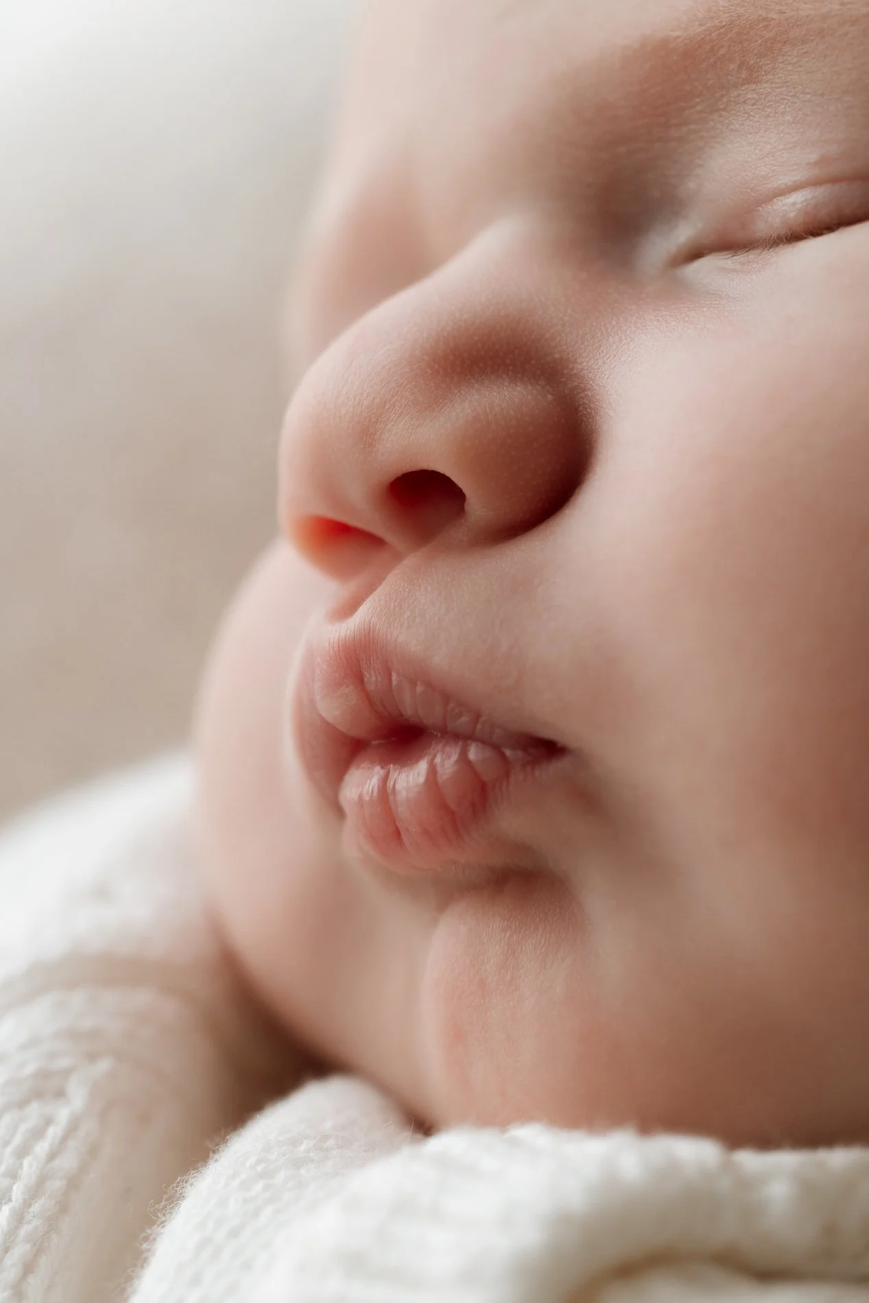 Close-up of a sleeping baby's face showing peaceful features.