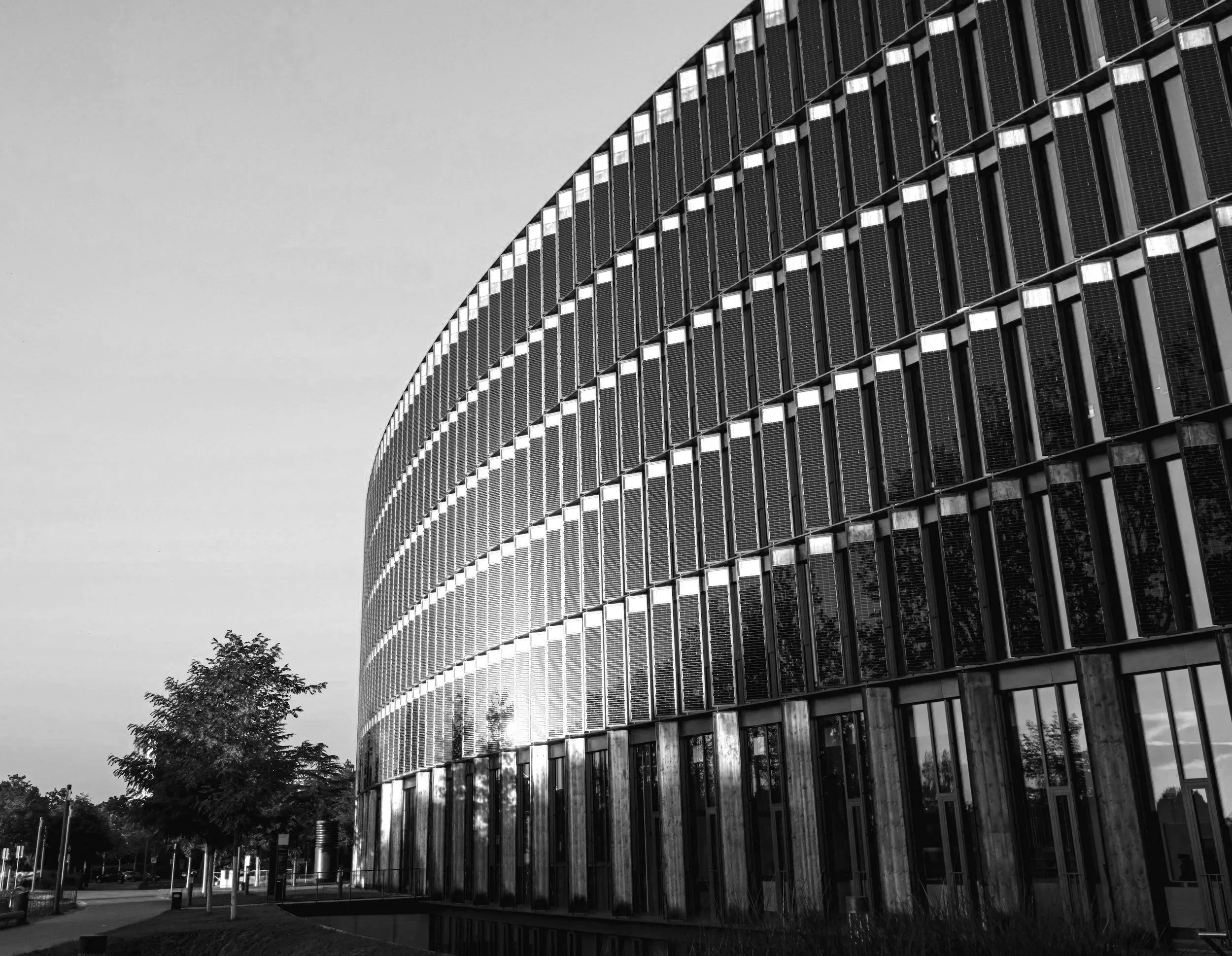 a mondern building with vertical photovoltaic systems