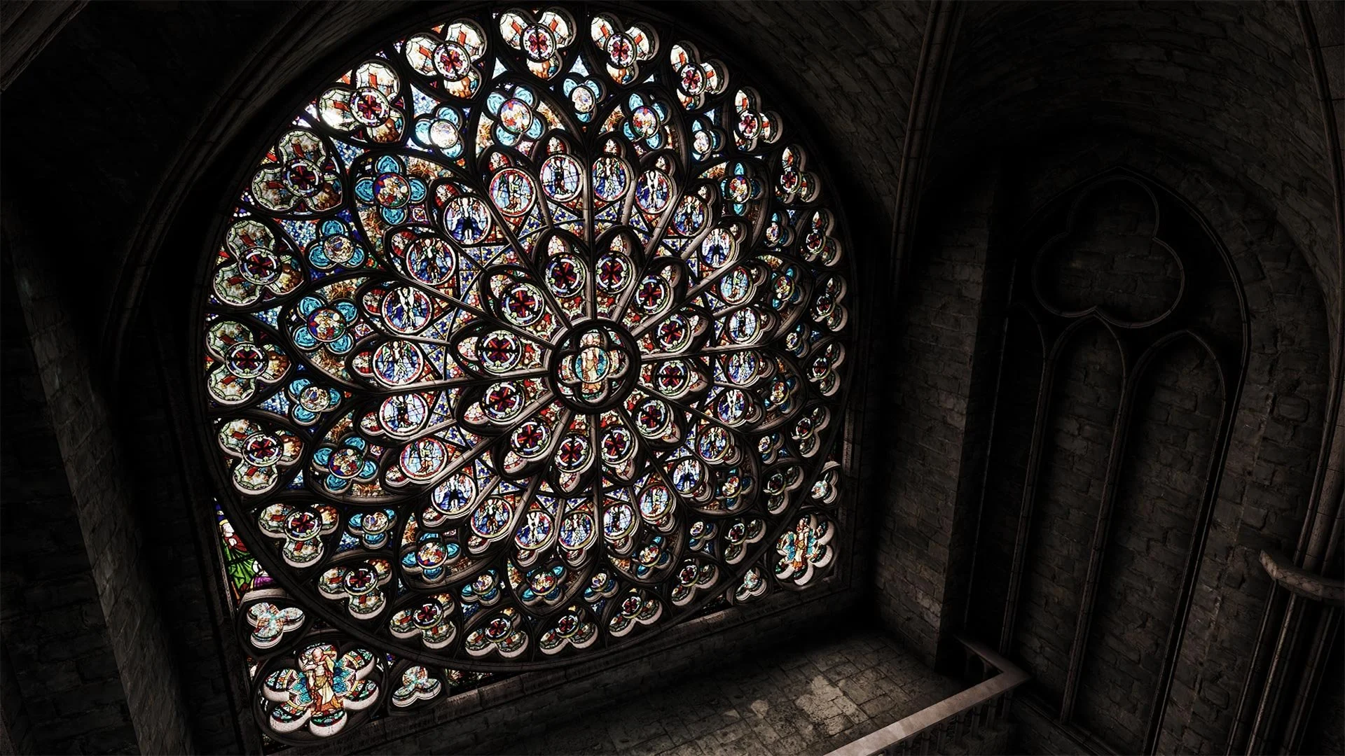 Colorful stained glass rose window in a dark stone church interior.