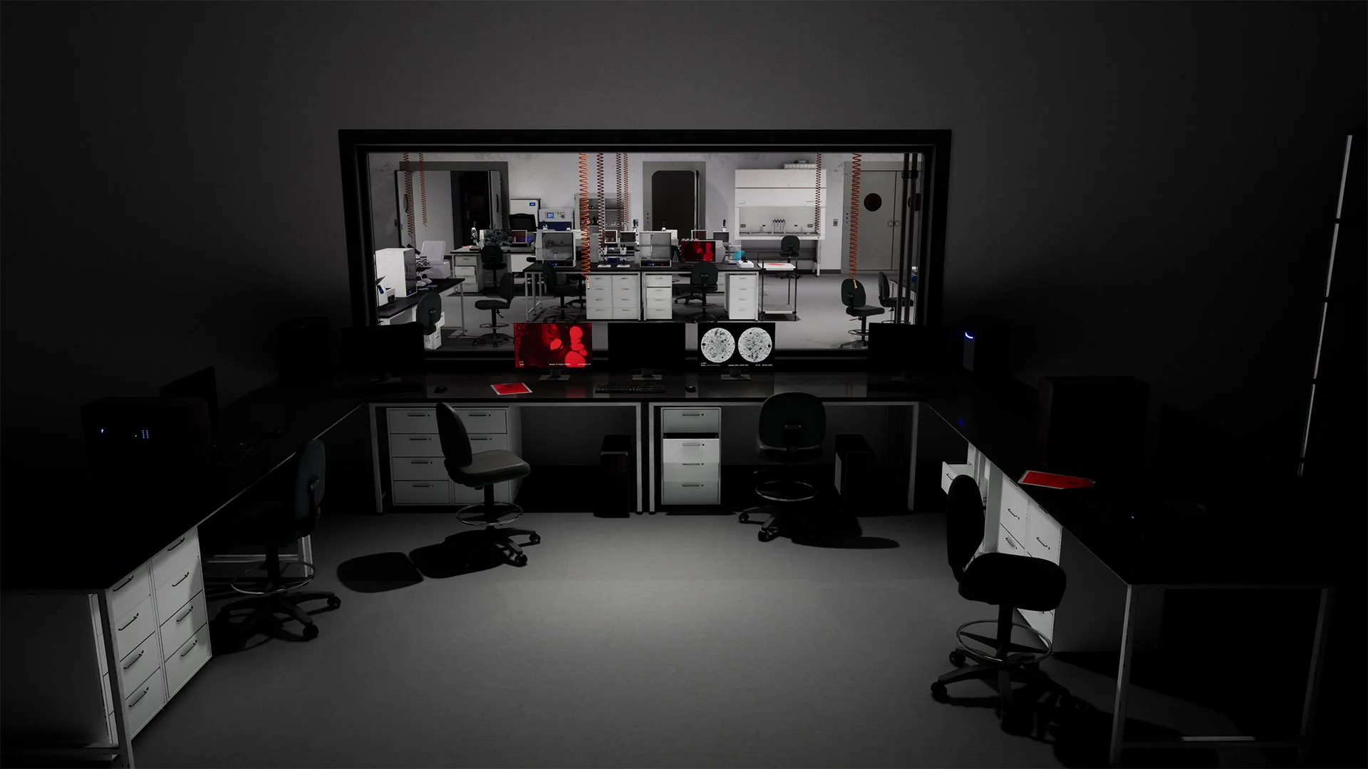 Laboratory with multiple workstations, monitors, and laboratory equipment, viewed from a darkened room with a large window.