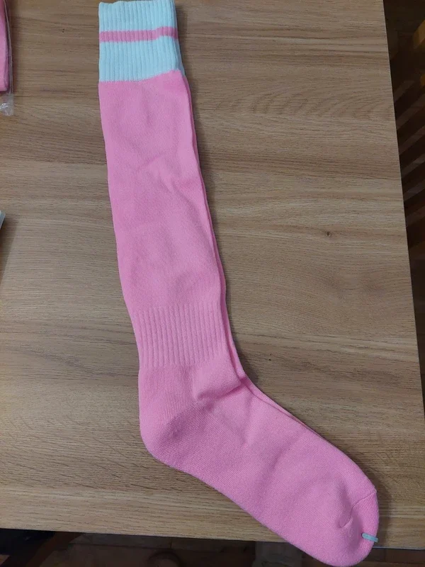 Pink and white sports socks. Med 3-6.