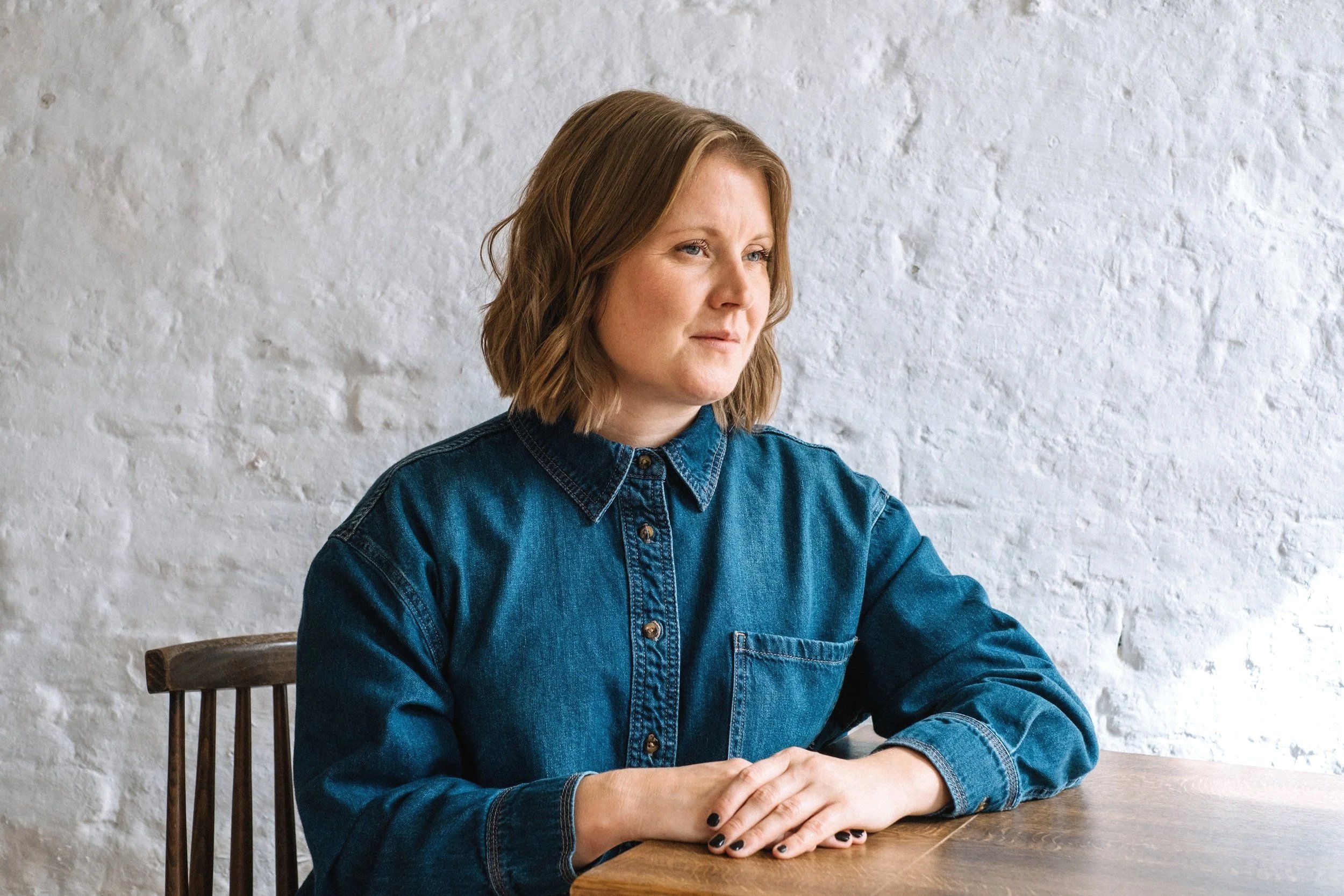 Samantha counsellor and psychotherapist seated at a table