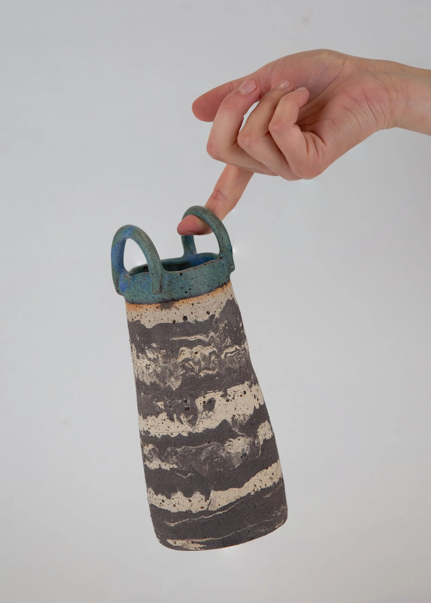 mixed-clays-beige, black, blue, and green