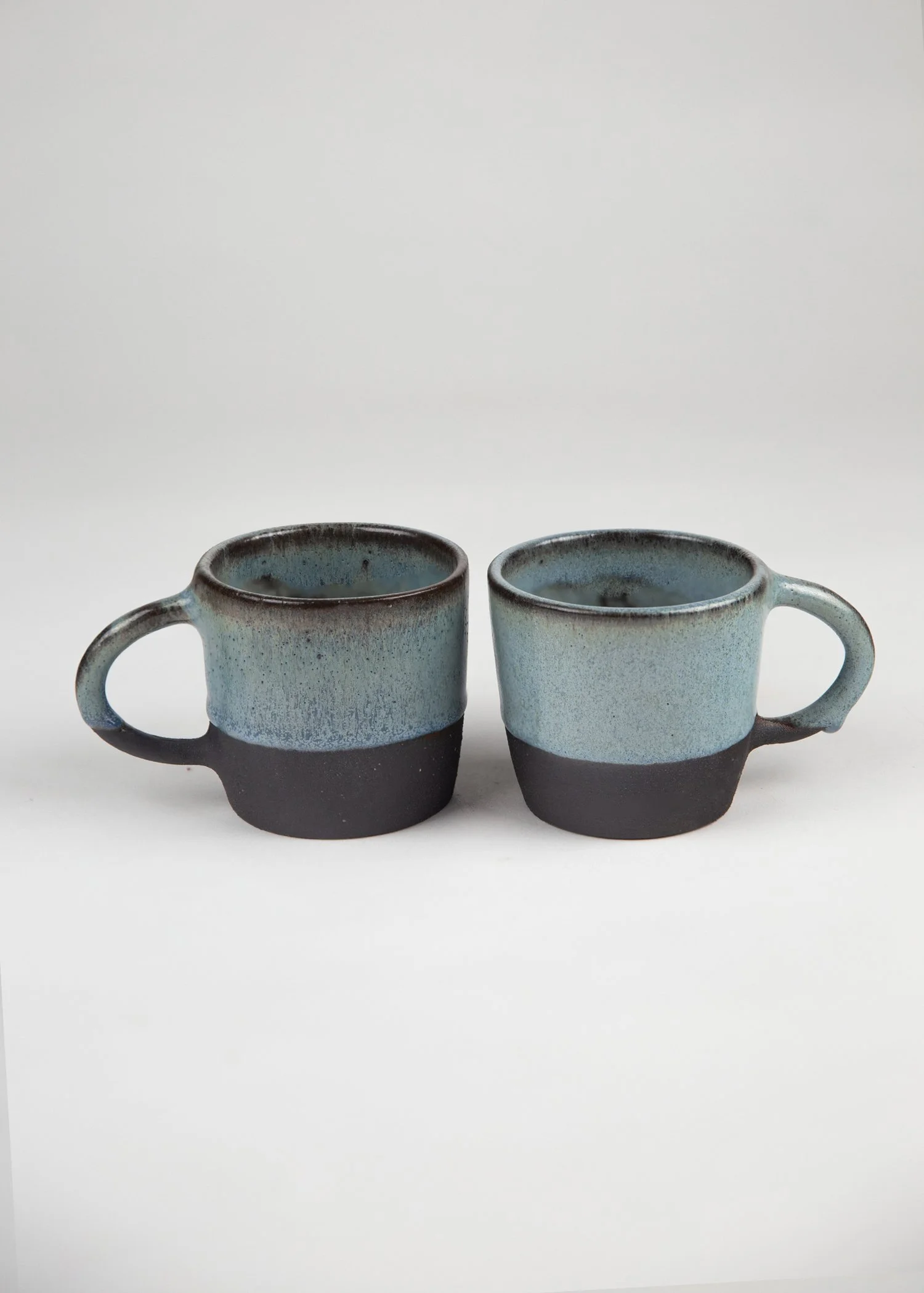 Set of Two Stoneware Cups in Volcanic Black with Blue Glaze-2