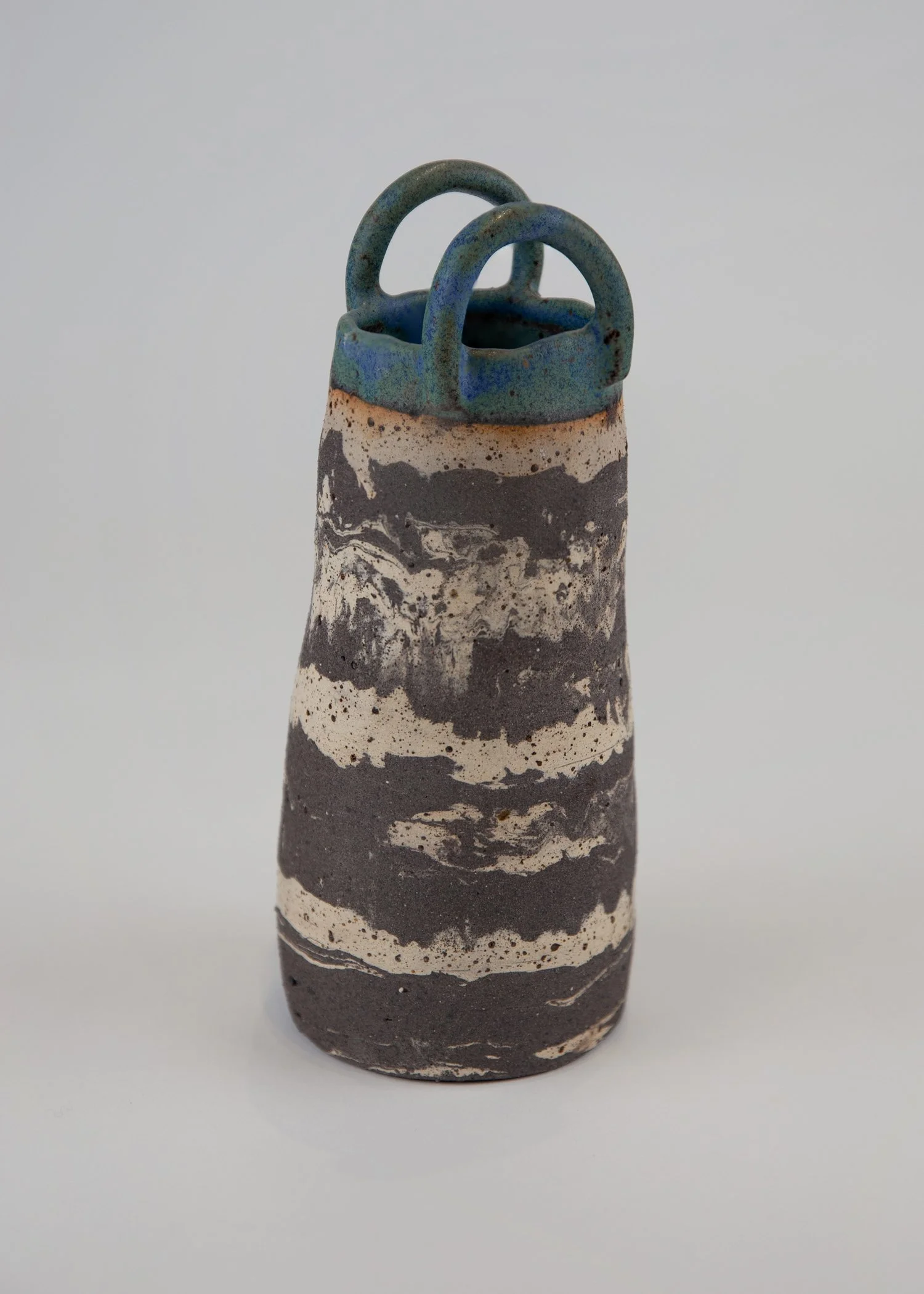 mixed-clays-beige, black, blue, and green