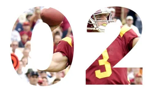 Large white number 02 with a football and a football player in a red and yellow uniform in the background.