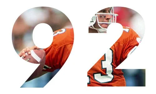 Number 92 in football uniform with orange jersey and white helmet.