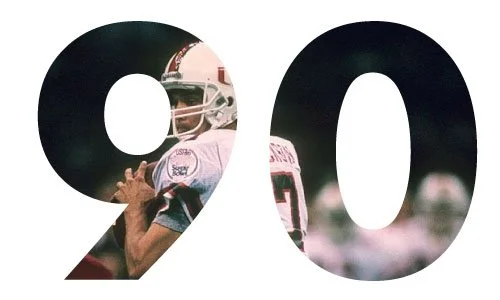 A large black number 90 with a picture of a football player in a helmet and uniform integrated into the digits.