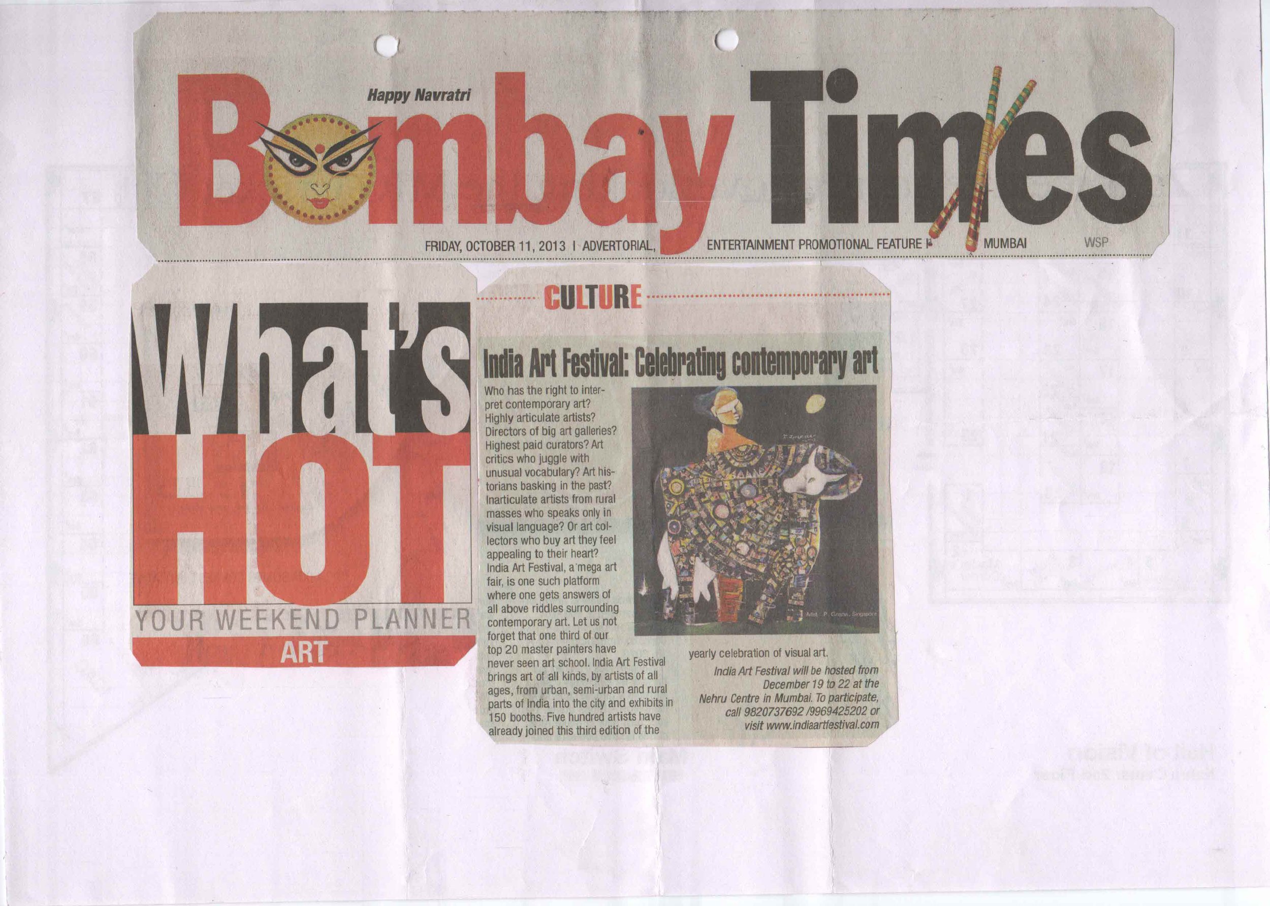 Front page of the Bombay Times newspaper dated October 11, 2013, featuring an article about the India Art Festival showcasing contemporary art, with an image of a colorful cow sculpture wearing a garment with intricate patterns.