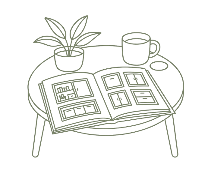 Outline of a coffee table with a potted plant, a mug, a container, and an open photo album on it.